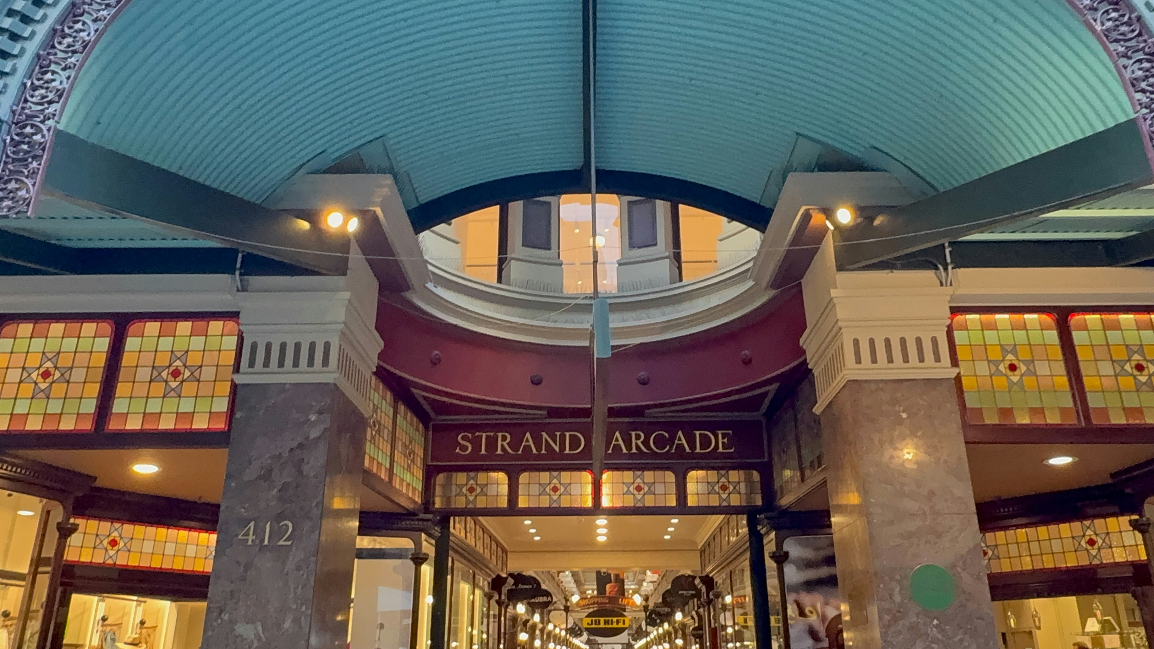 The entrance to the Strand Arcade with stained glass panels and marble columns