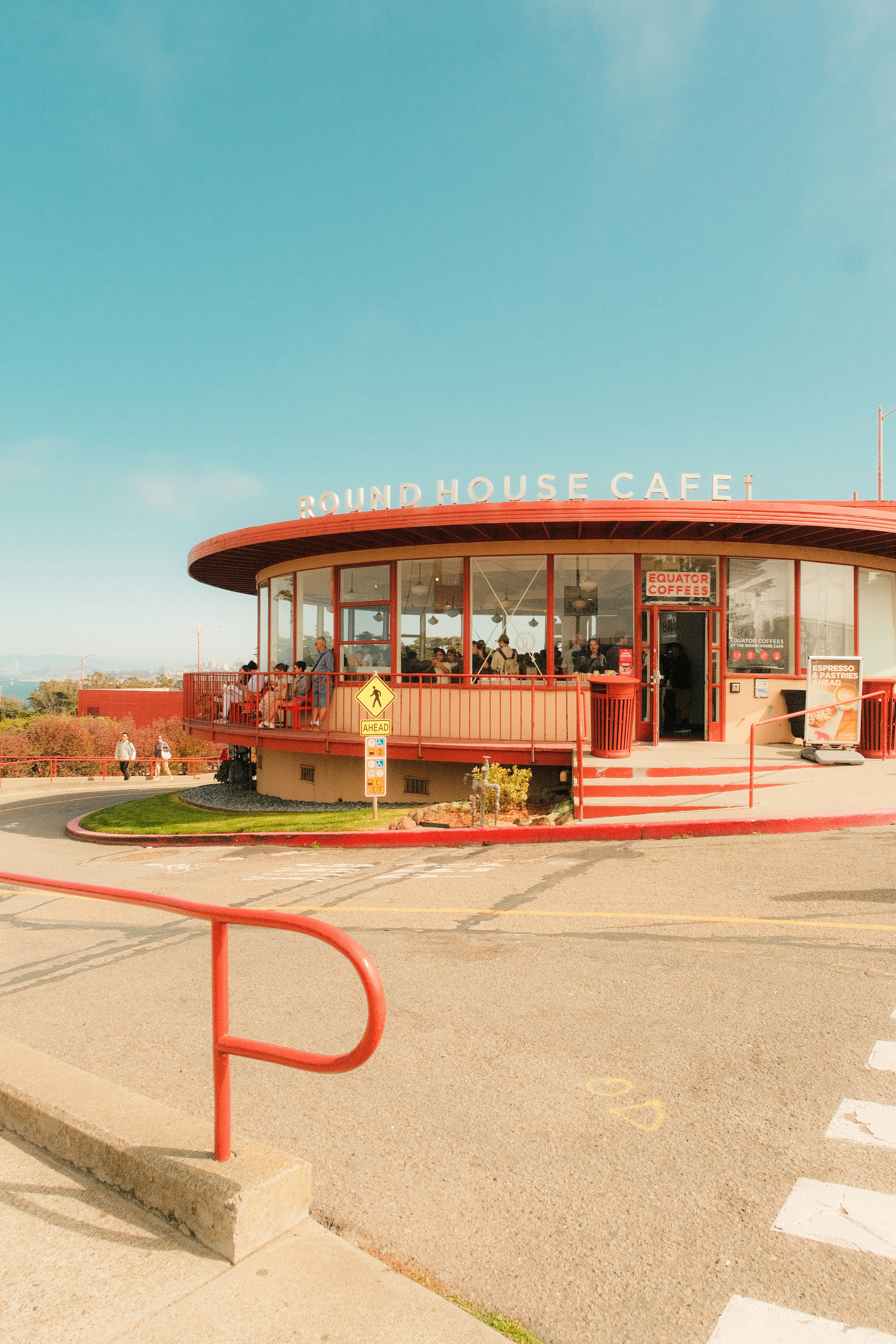 The Round House Cafe with red trim and glass walls in San Francisco