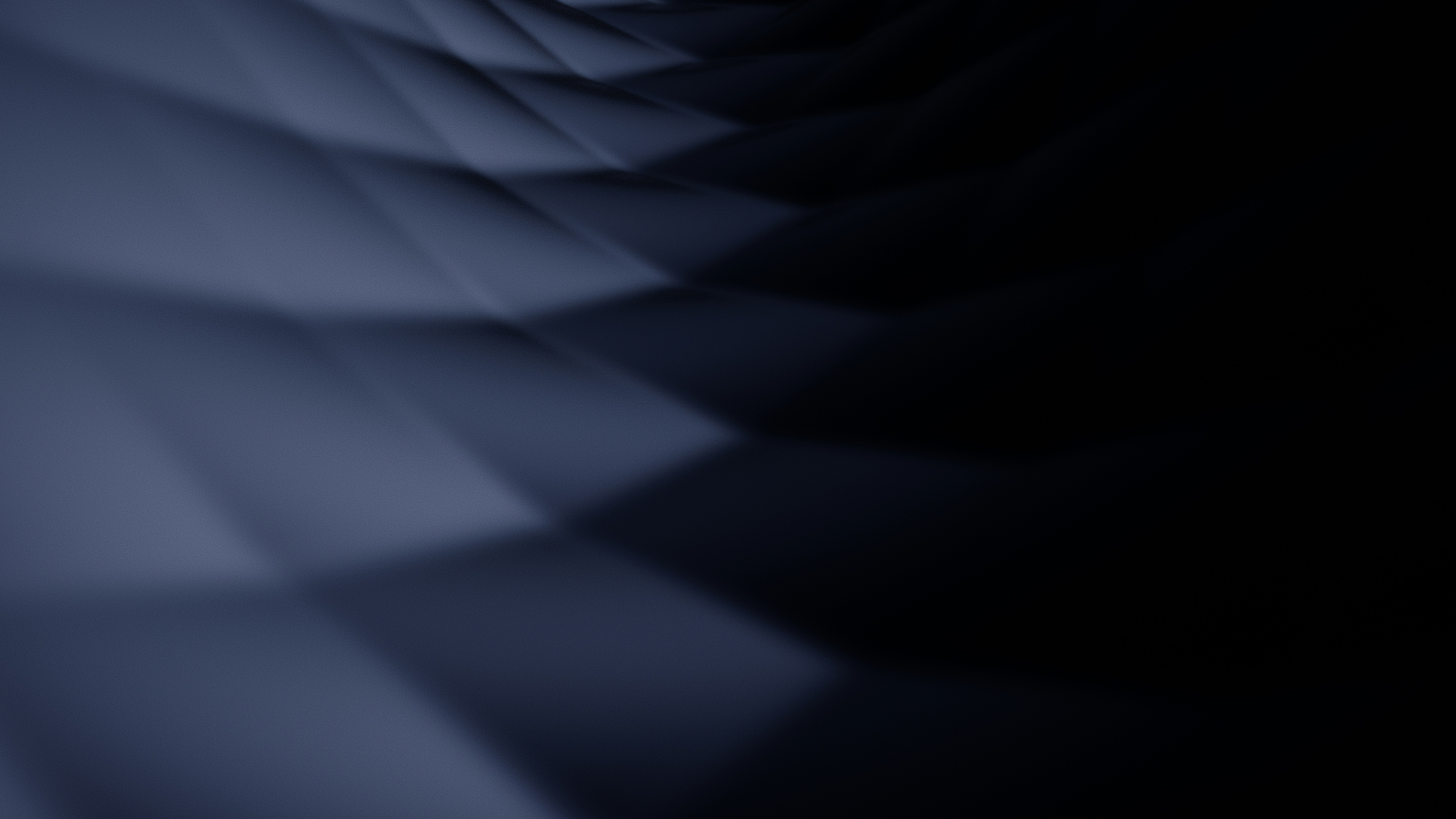 A dark blue geometric pattern with soft shadows and a blurred focus