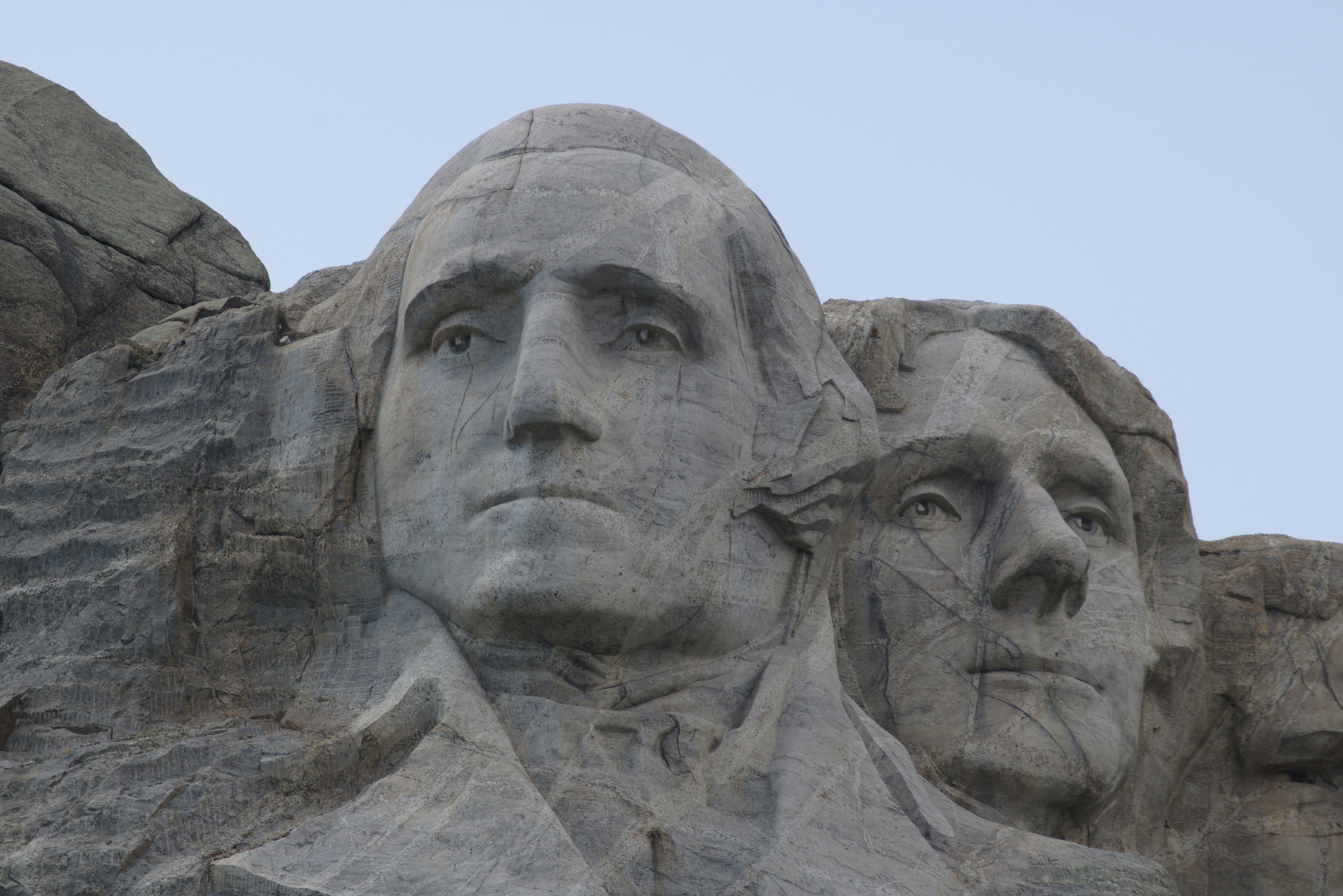 The stone faces of George Washington and Thomas Jefferson at Mount Rushmore in South Dakota