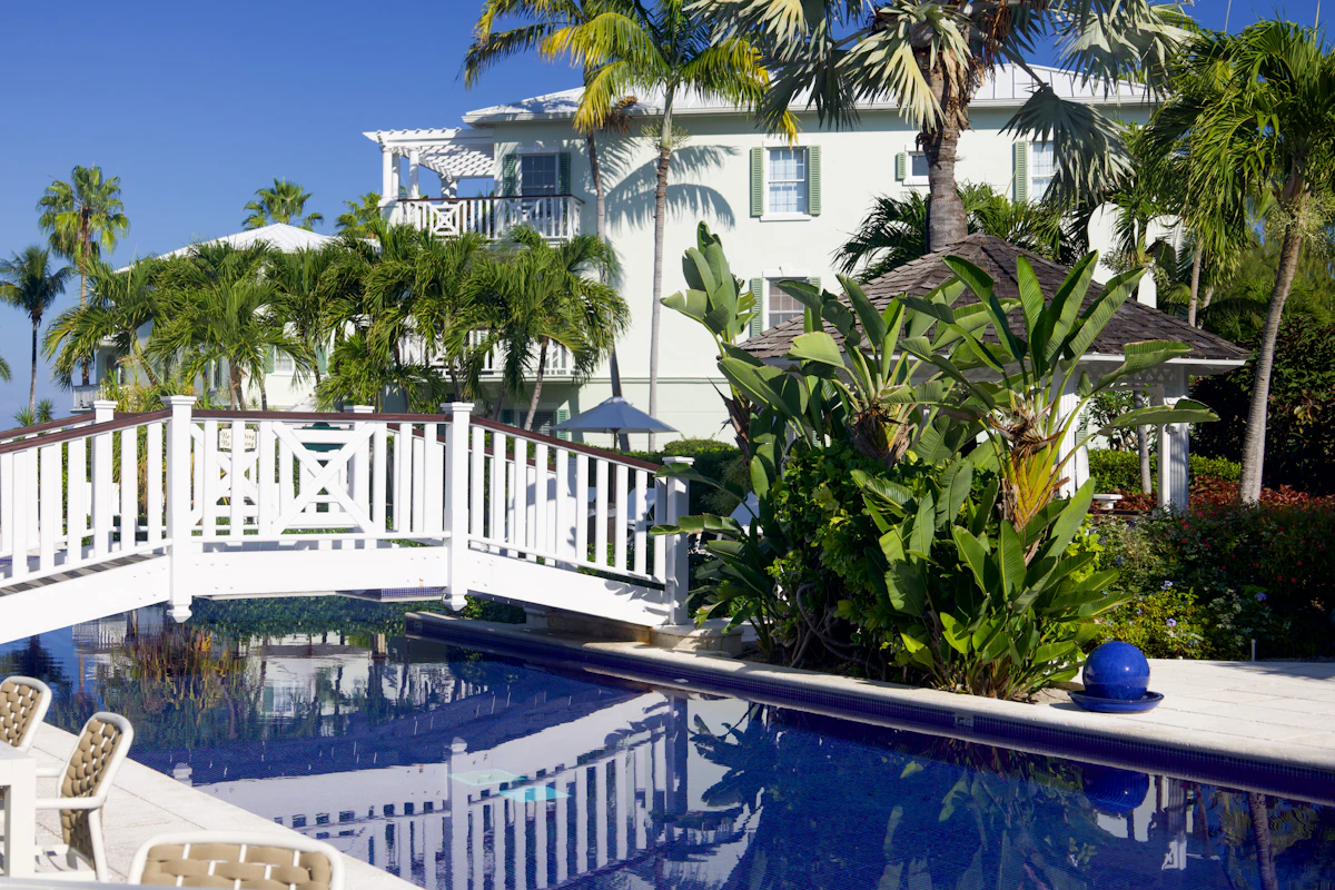 A resort swimming pool with a bridge at a Caribbean beach resort