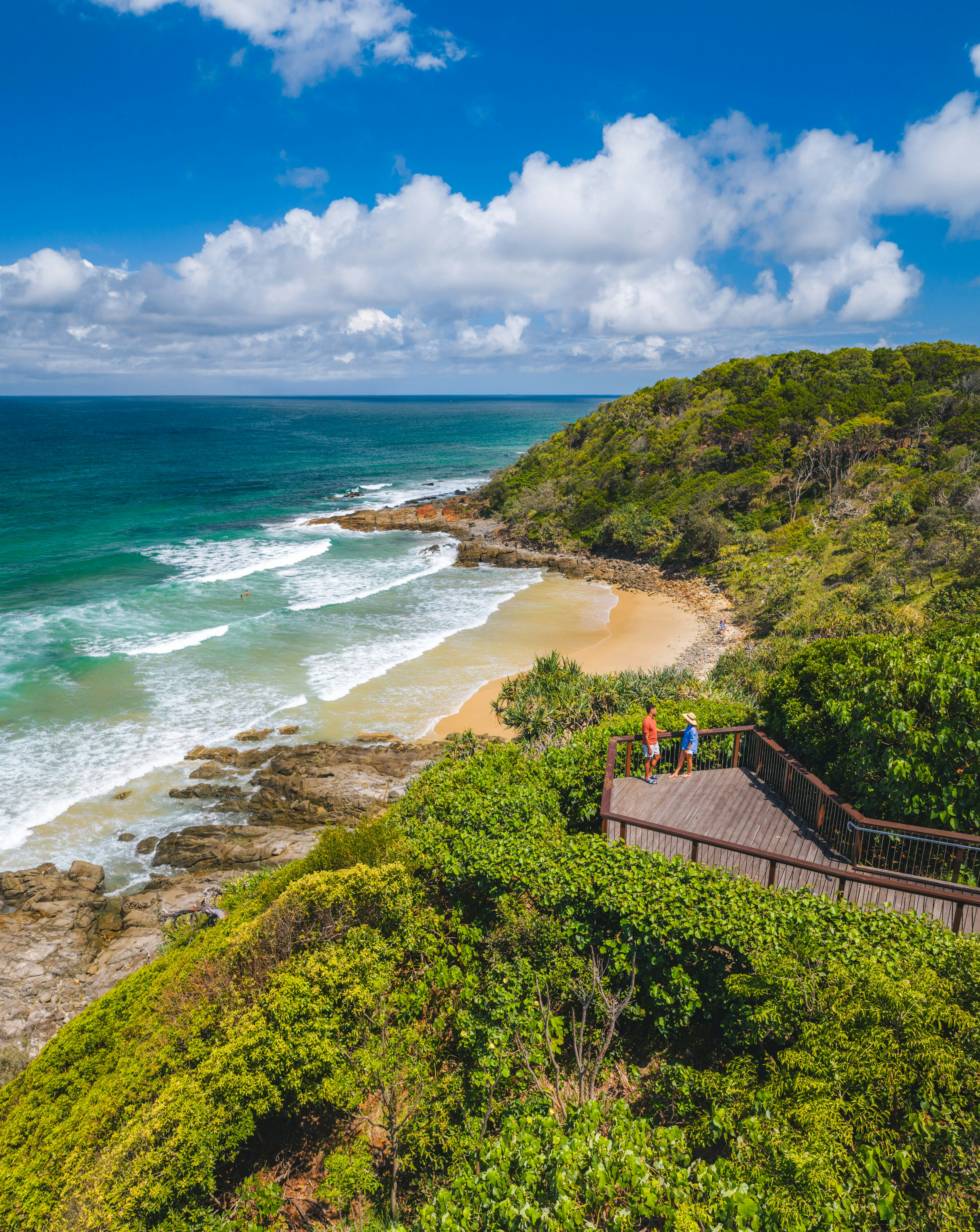 Couple exploring the secluded beach cove and surrounding pathways
