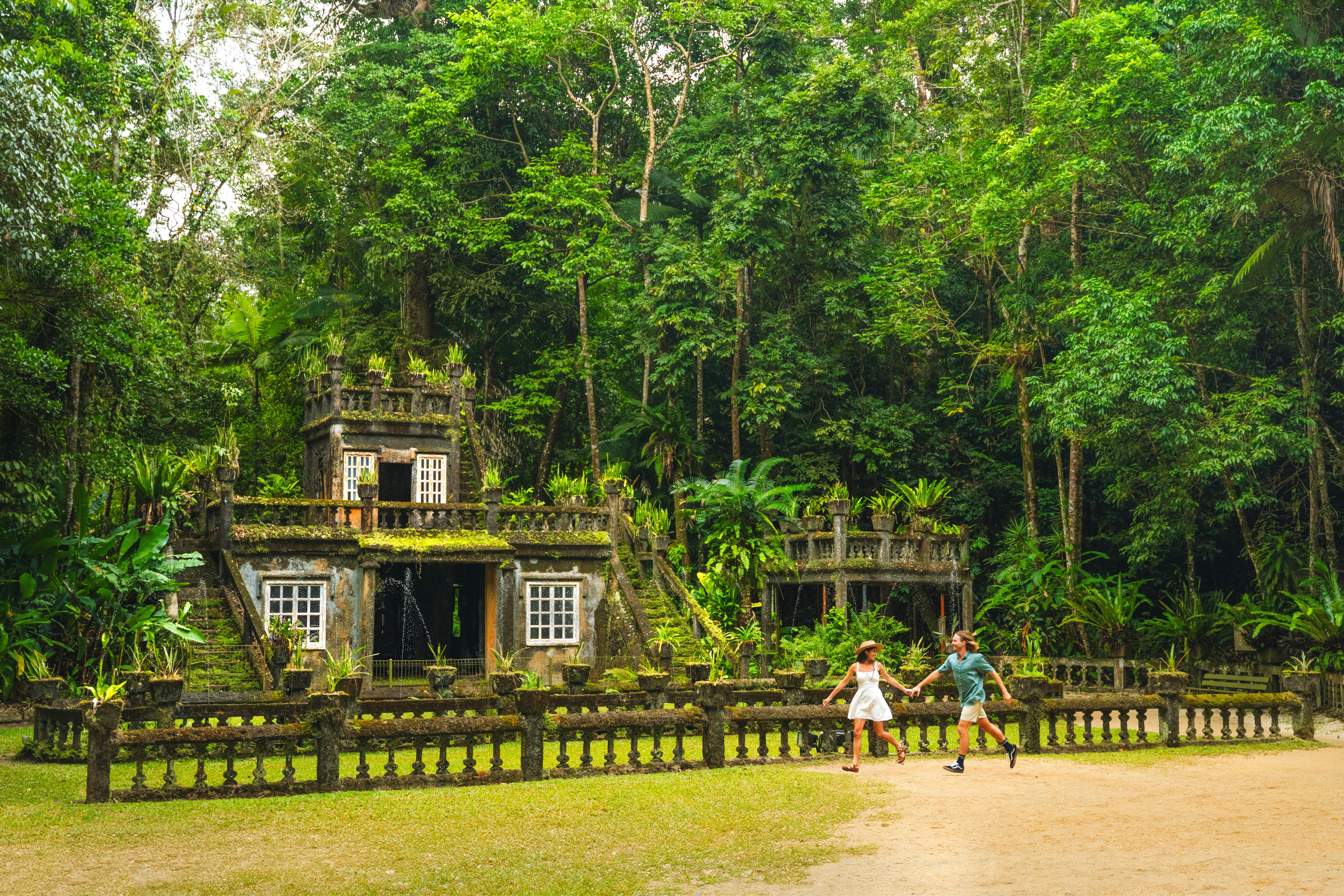 Couple exploring the park set among the lush rainforest