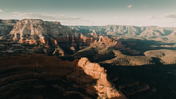 Red rock formations and canyons in Sedona under a clear blue sky