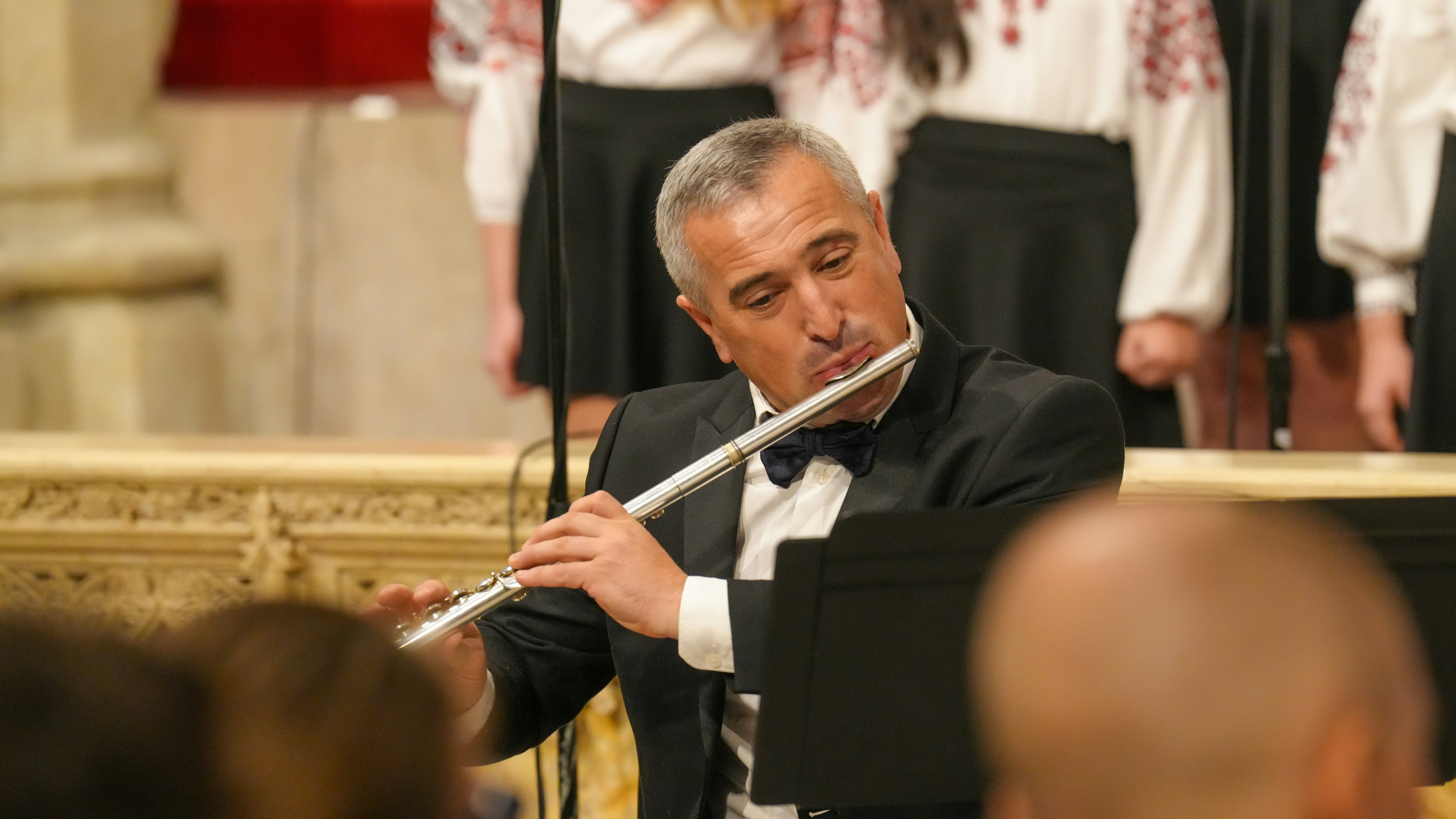 Man playing flute in tuxedo - Free Photo on Unsplash