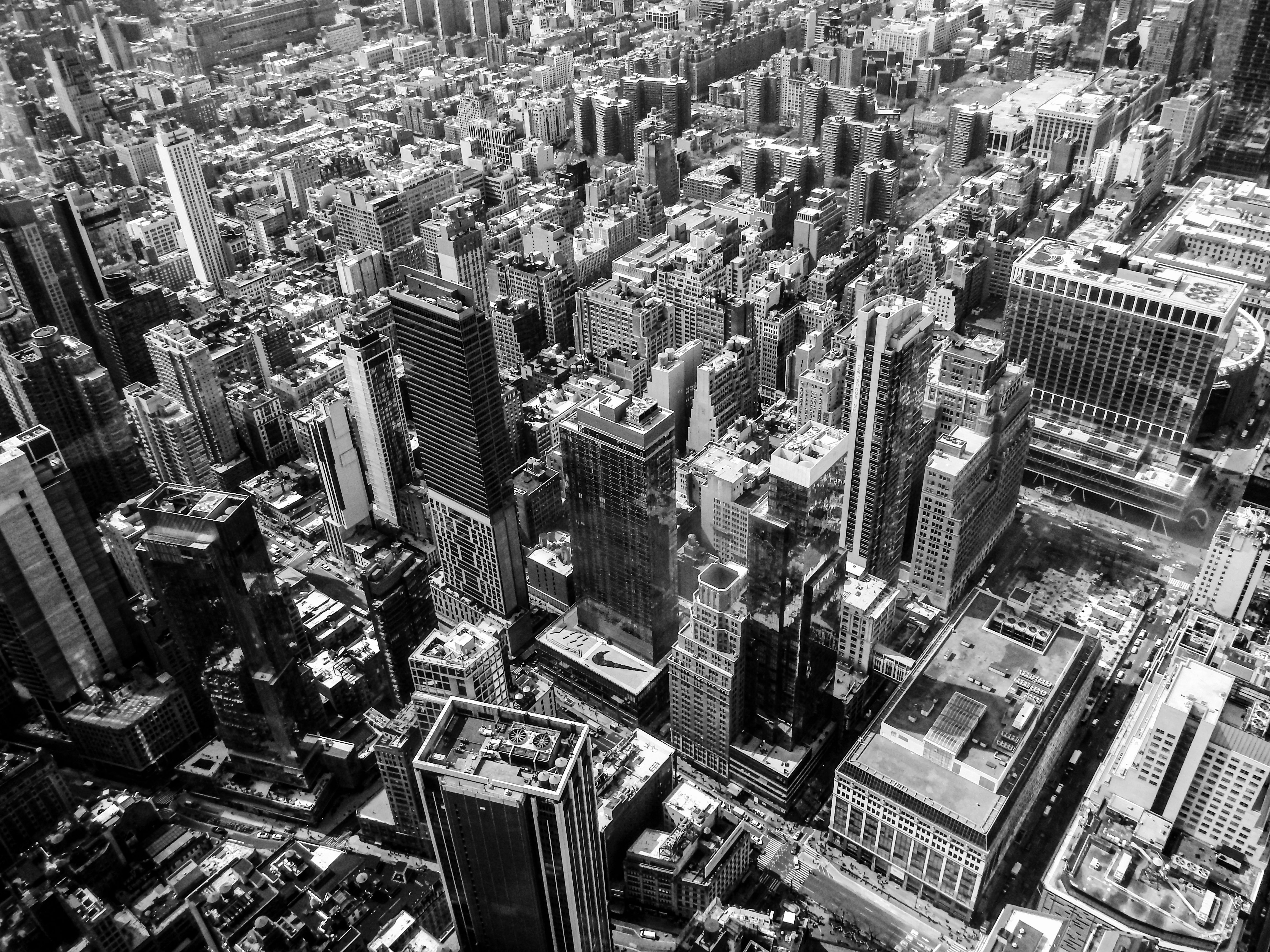 An aerial view of dense skyscrapers and city streets in New York City