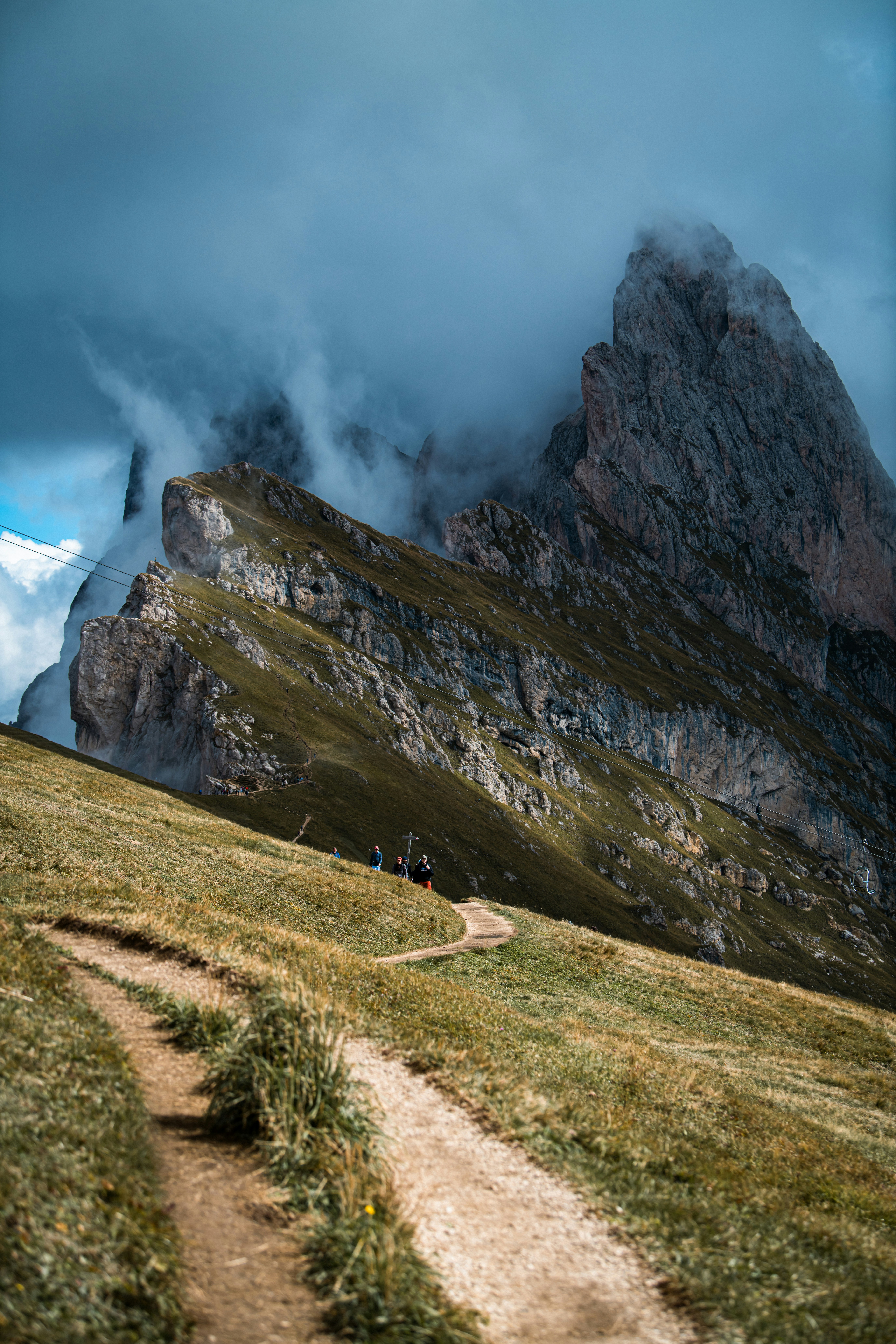 People on path toward rocky mountains - Free Photo on Unsplash