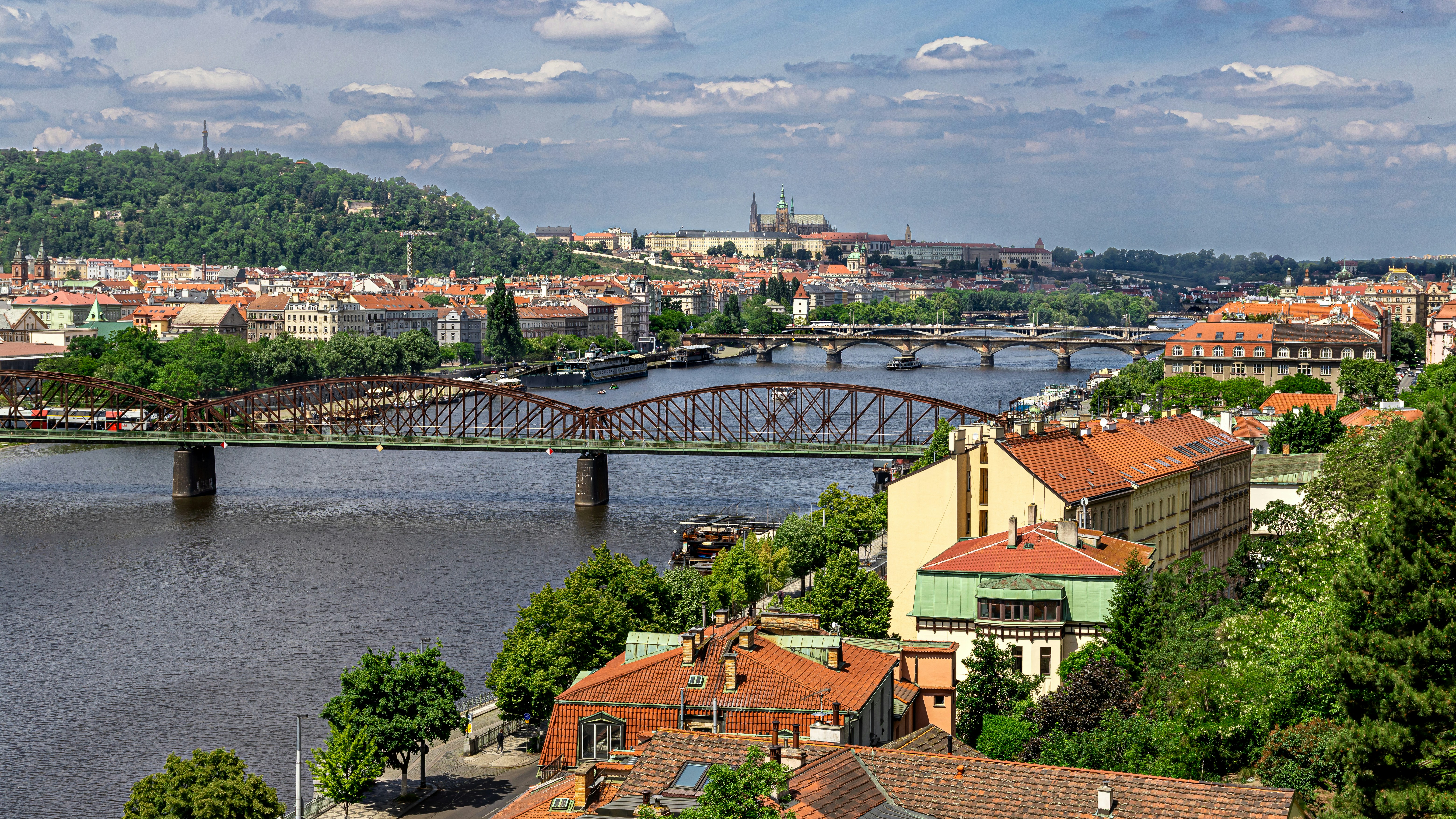 The Vltava river flowing past bridges and historic buildings in Prague, Czech Republic