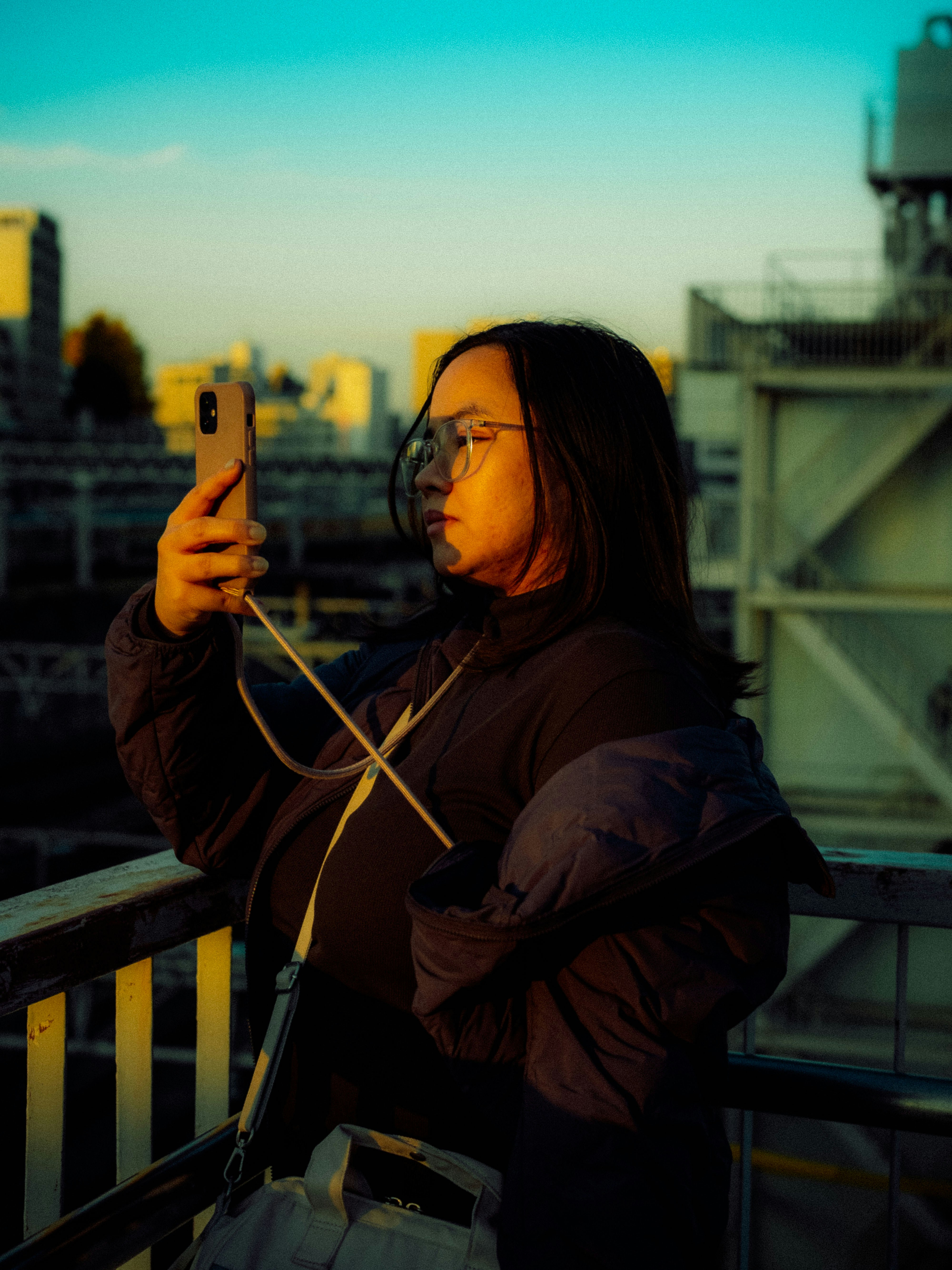 Person with smartphone on bridge - Free Photo on Unsplash