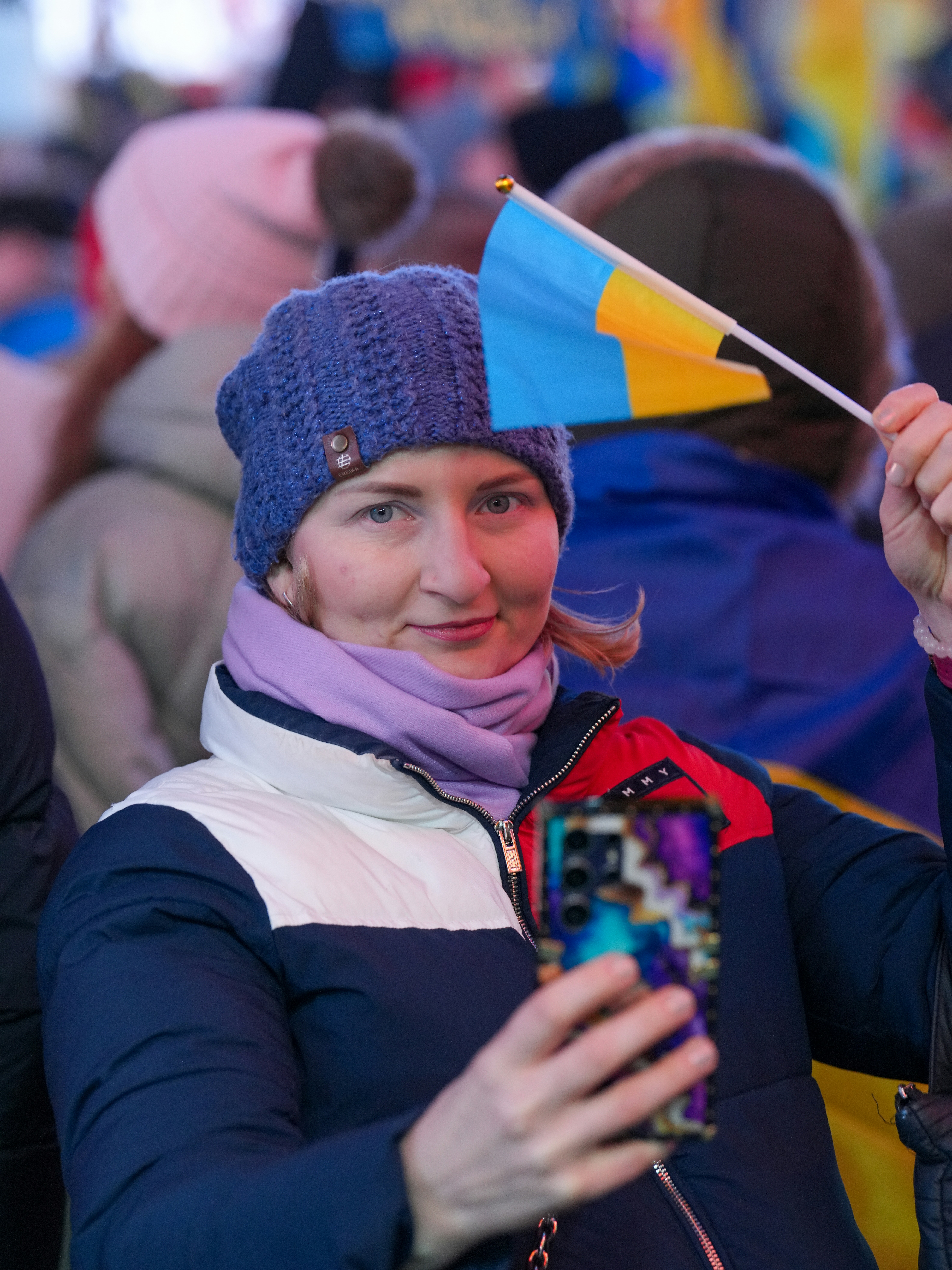 Woman holding small Ukrainian flag - Free Photo on Unsplash