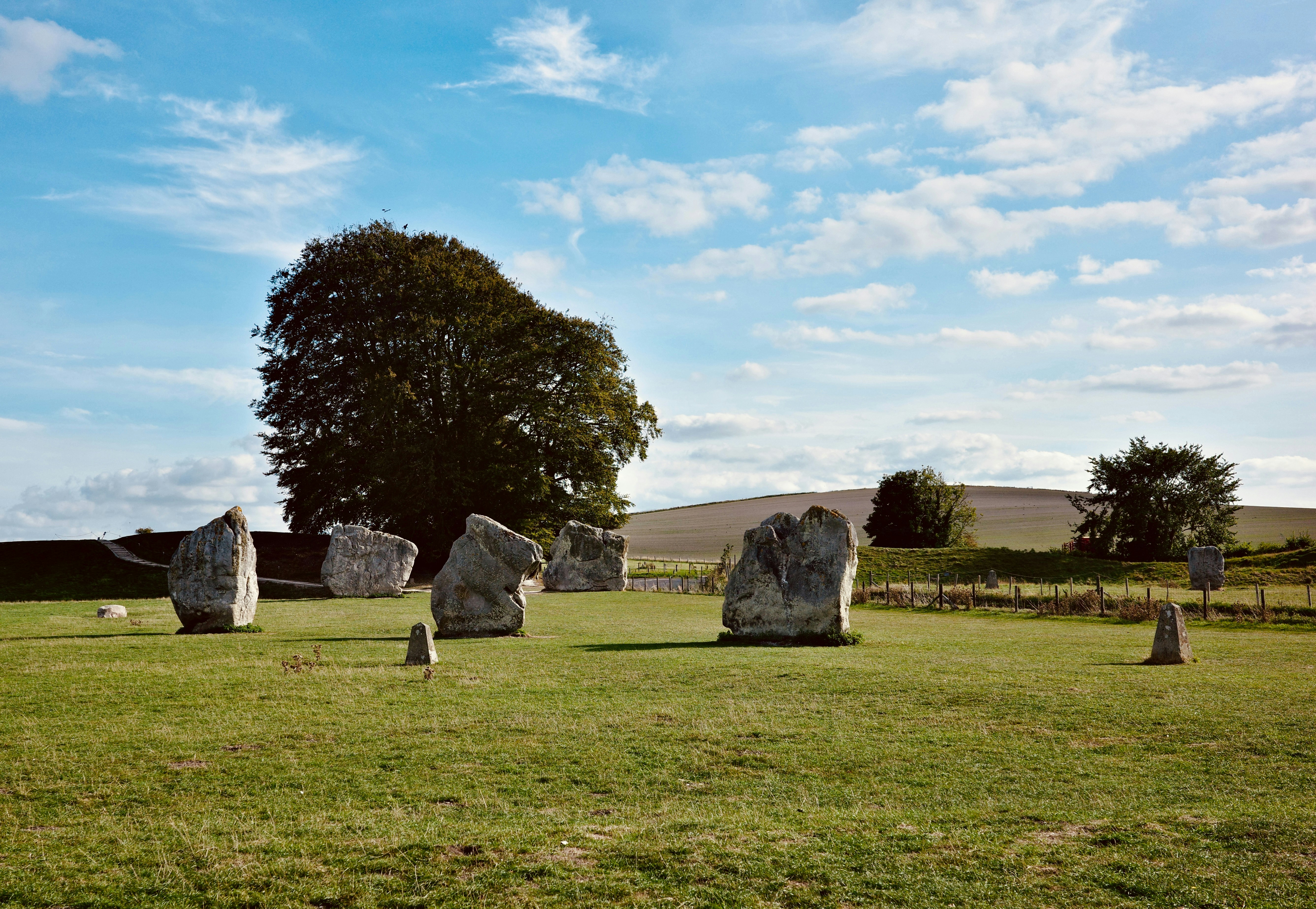 Large standing stones in a grassy field near Avebury in Wiltshire, England