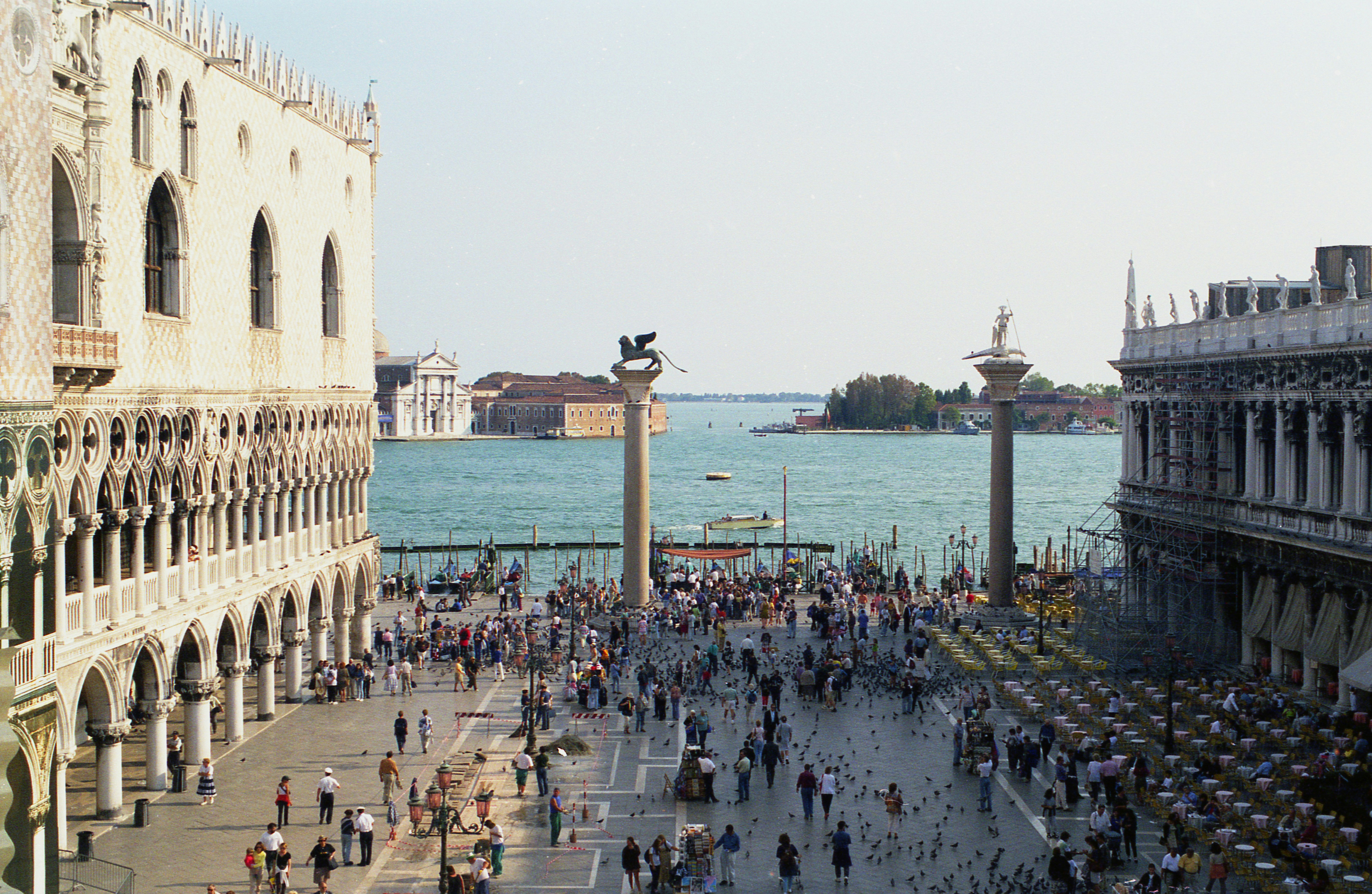 Crowd of people in the Piazzetta di San Marco in Venice with the Doge's Palace