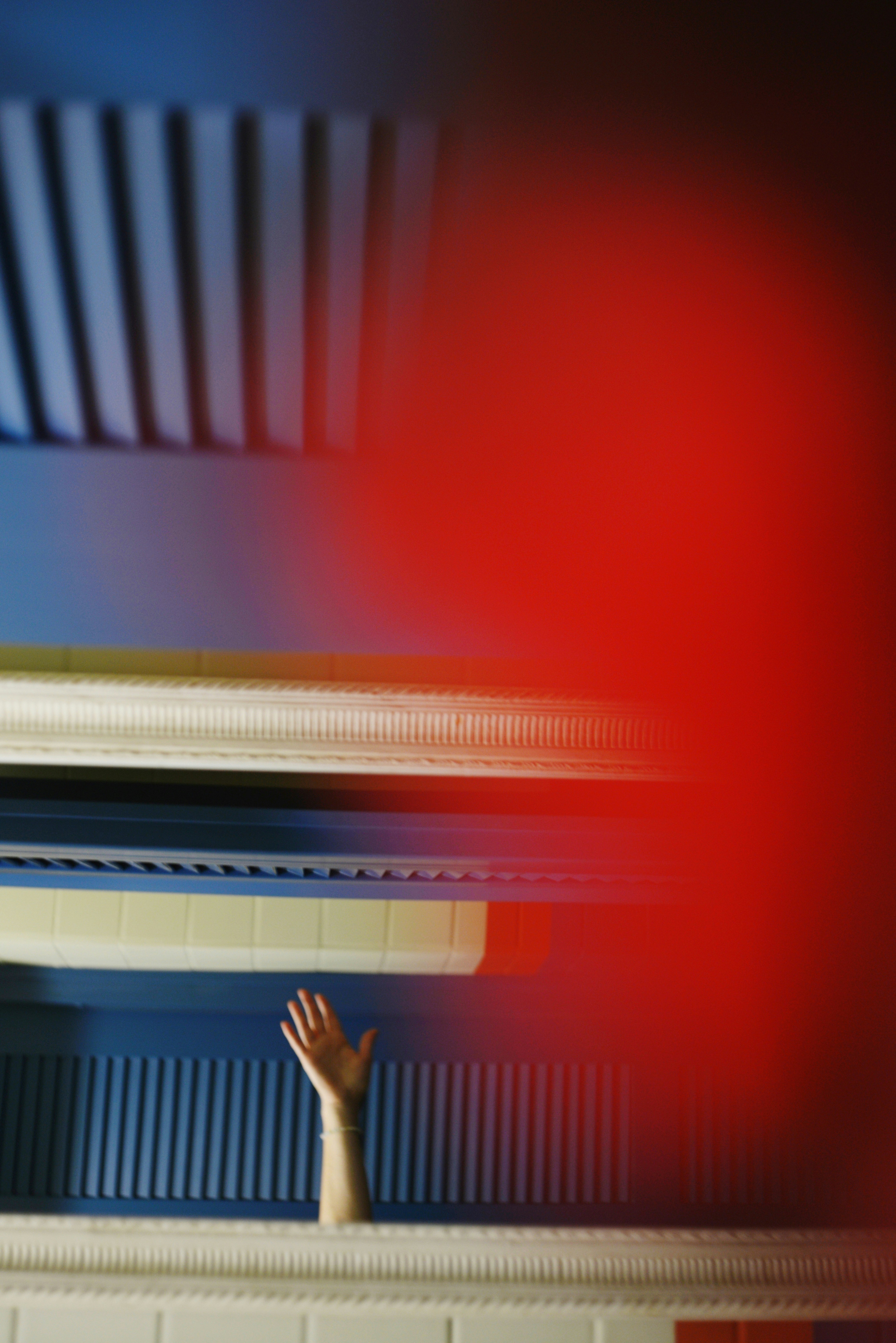 Hand reaching toward blue ceiling - Free Photo on Unsplash