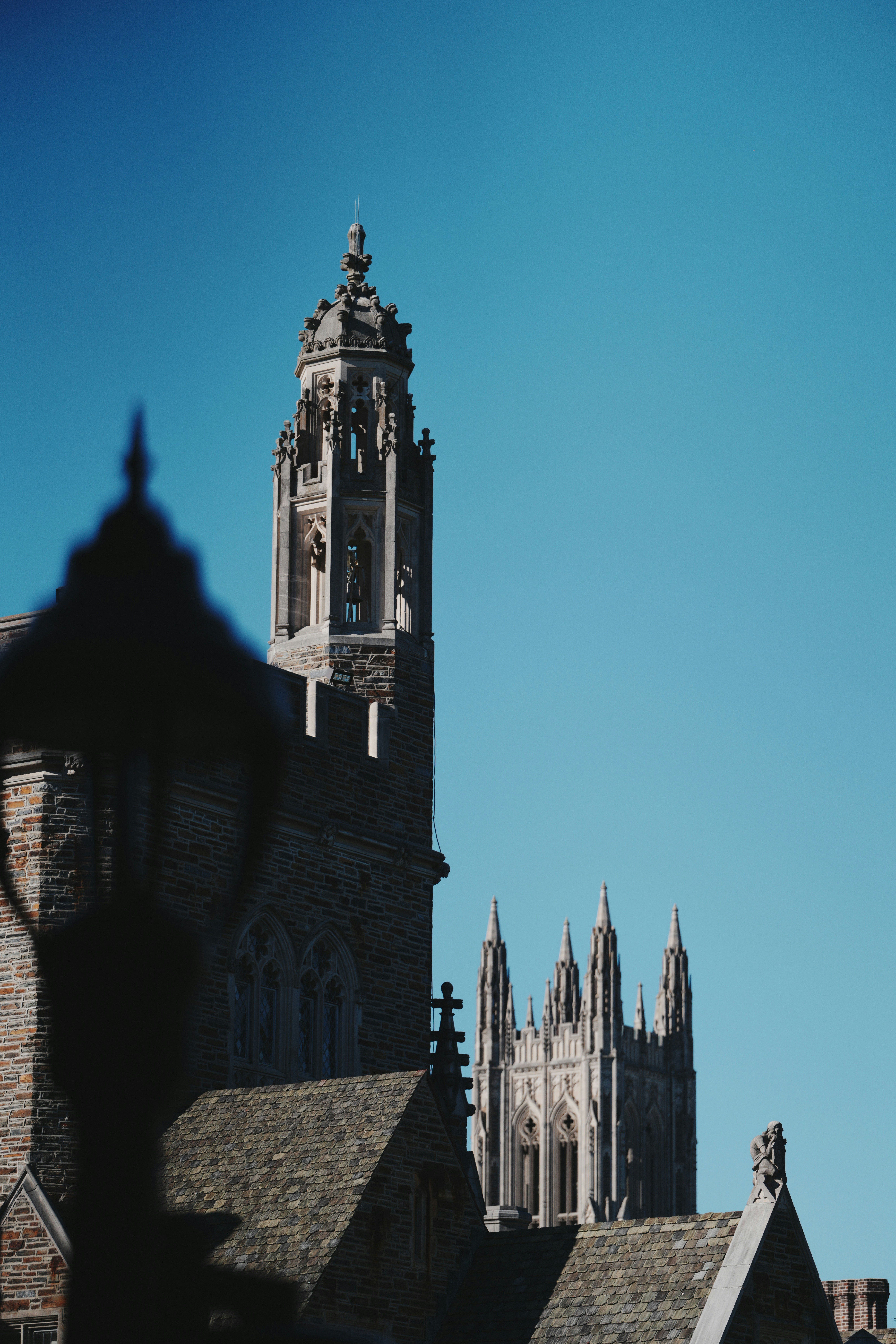 Gothic stone towers against blue sky - Free Photo on Unsplash