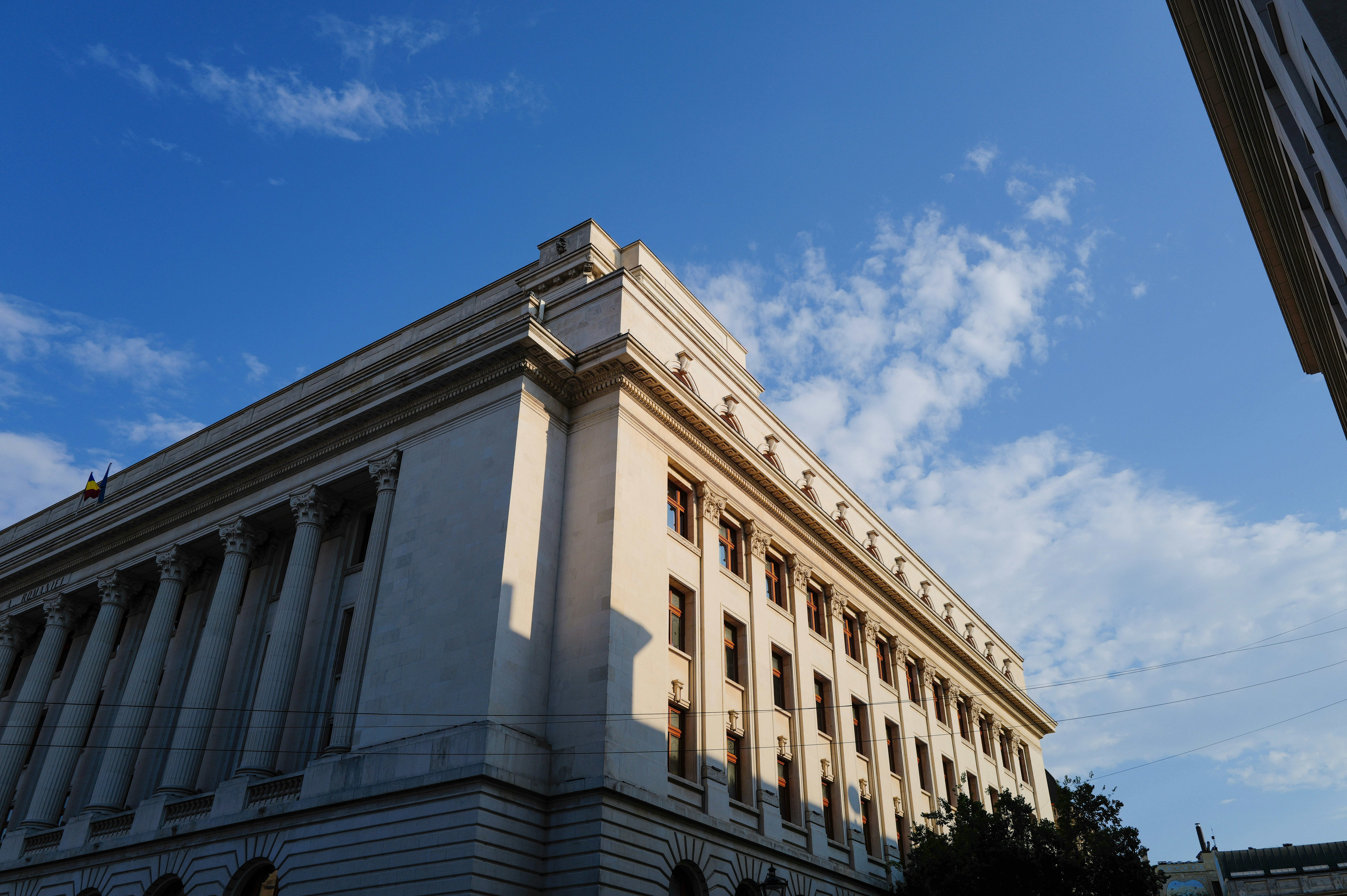 Neoclassical building with tall columns under blue sky