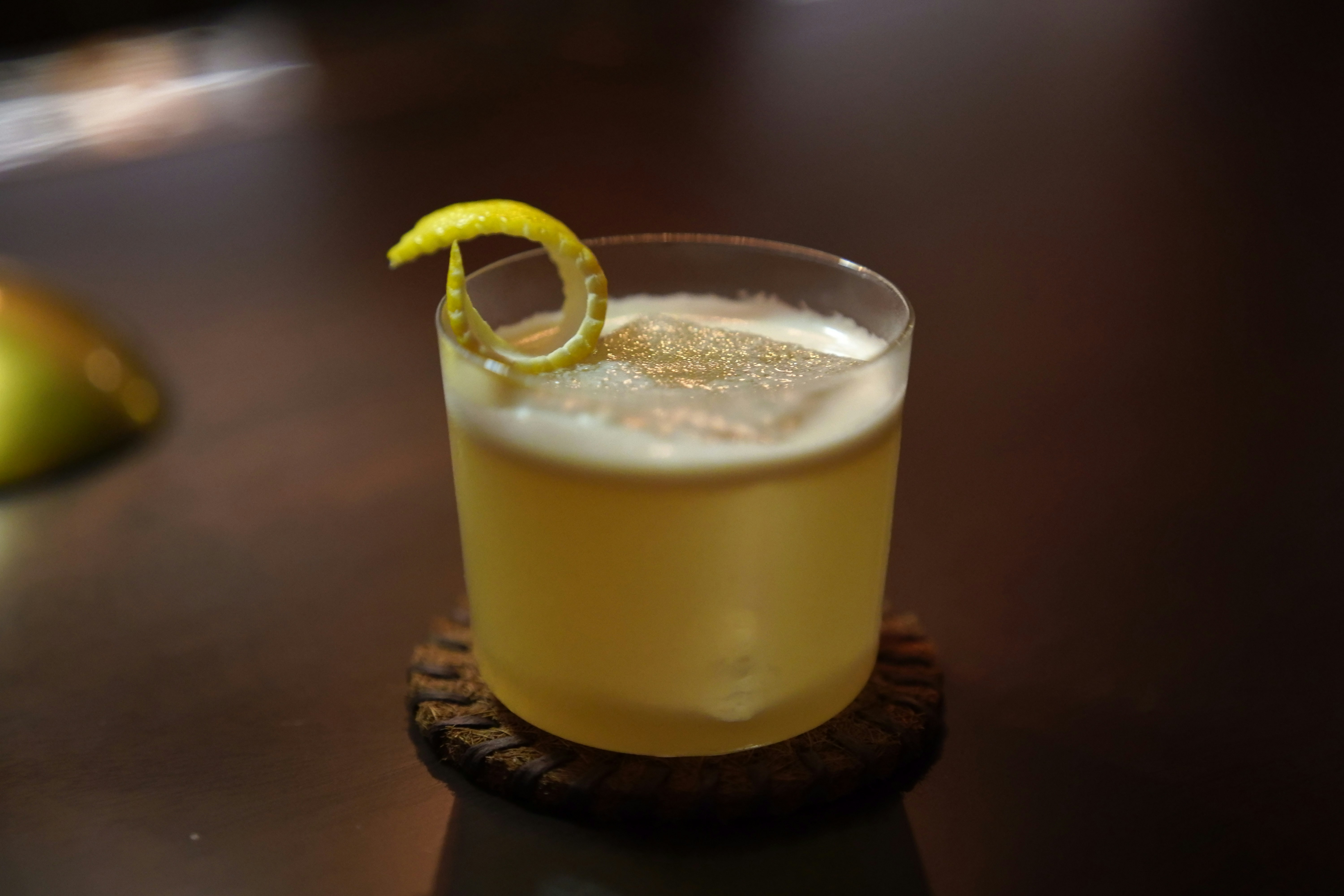 Yellow sour with lemon twist