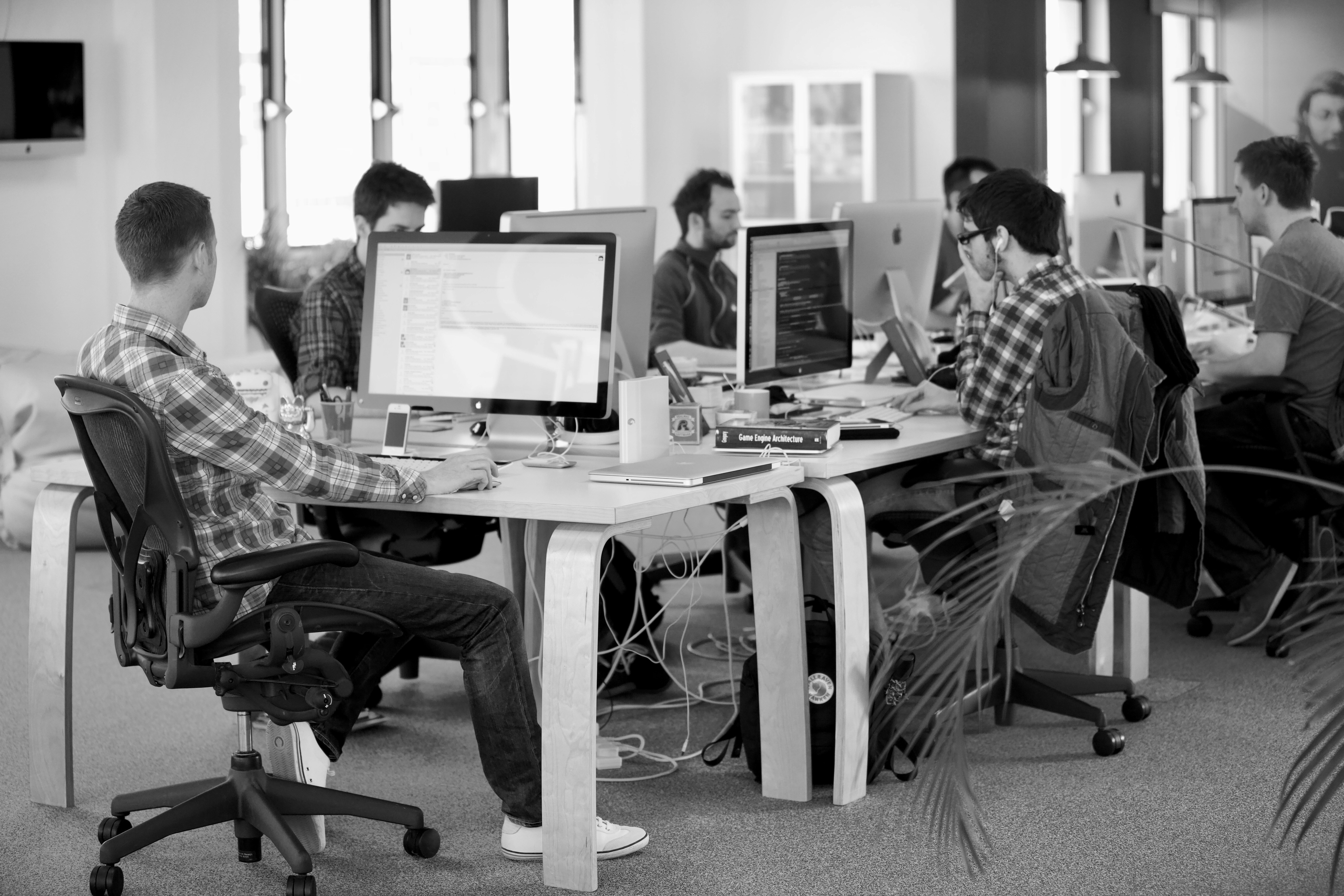 Drigatech engineers collaborating on SCADA architecture in the office