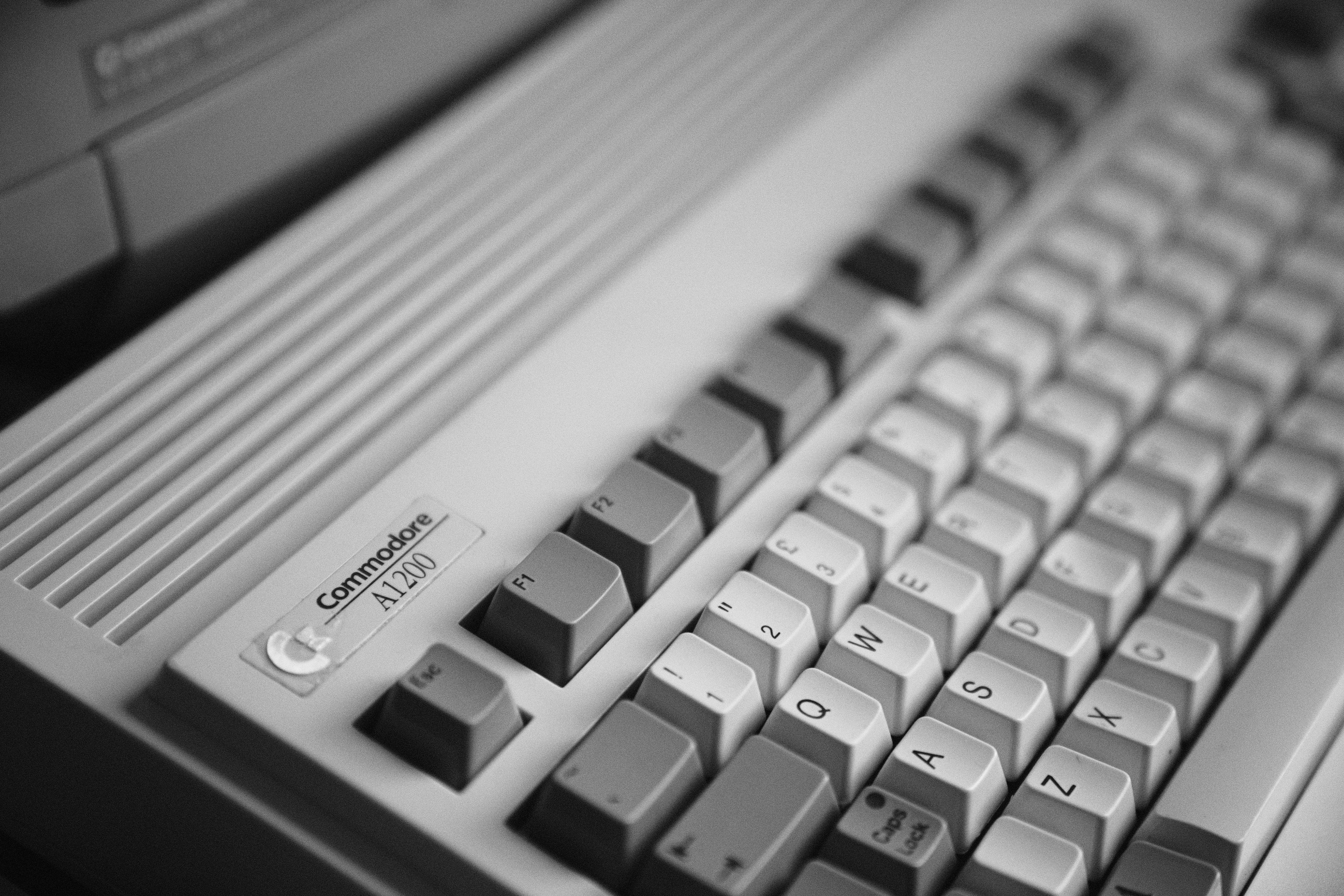 A vintage Commodore A1200 computer keyboard with grey and white keys