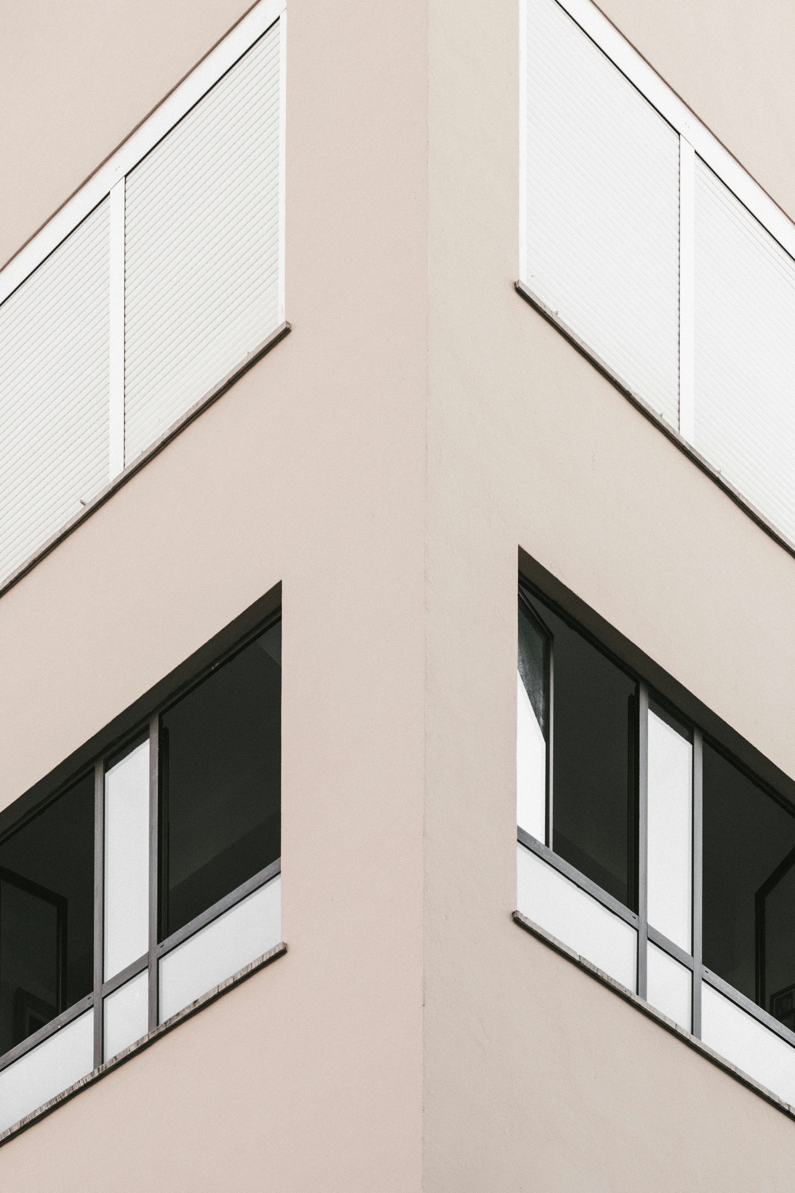 Beige building corner with windows - Free Photo on Unsplash