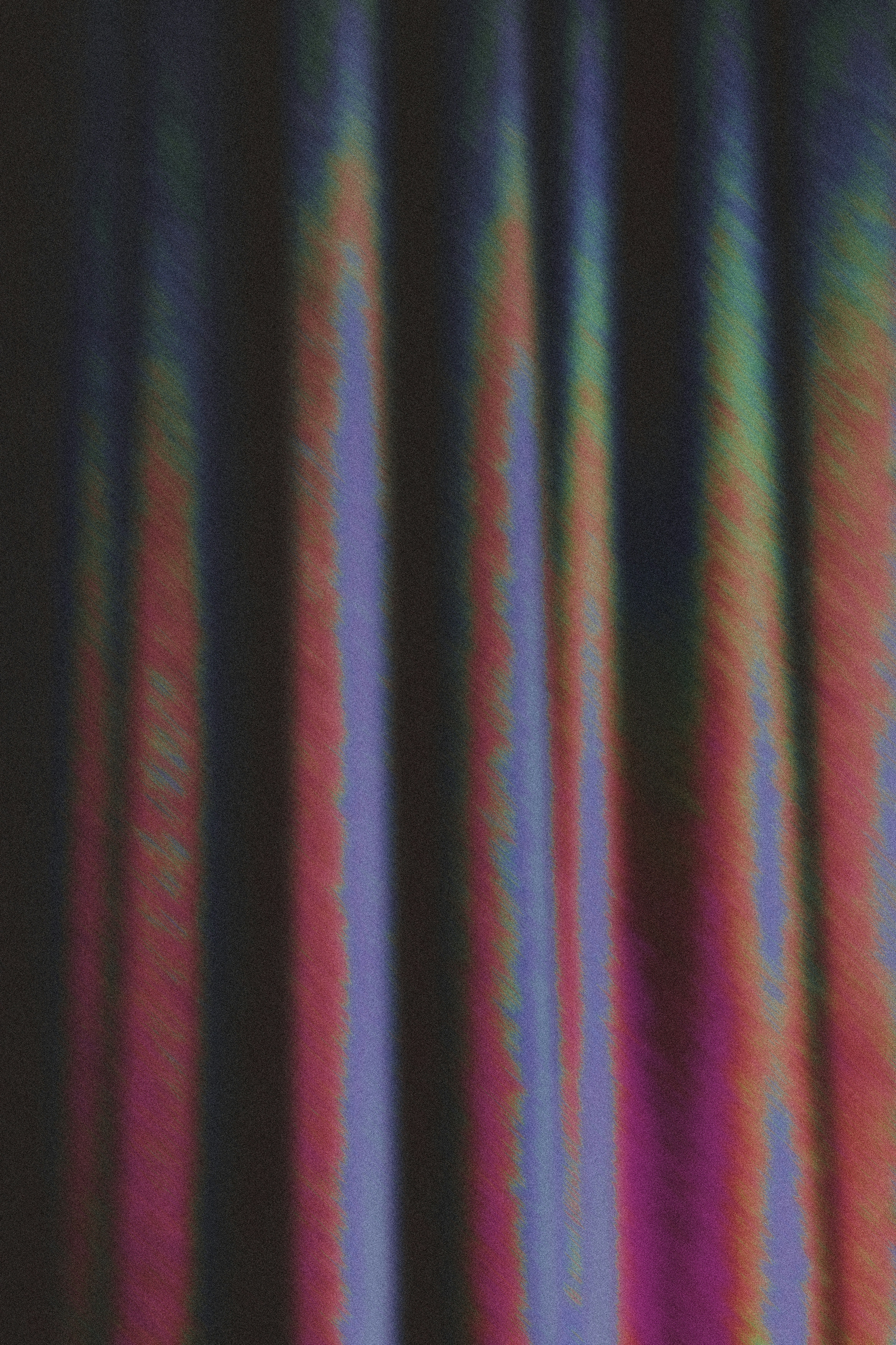 Vertical folds of fabric with iridescent purple and orange light streaks