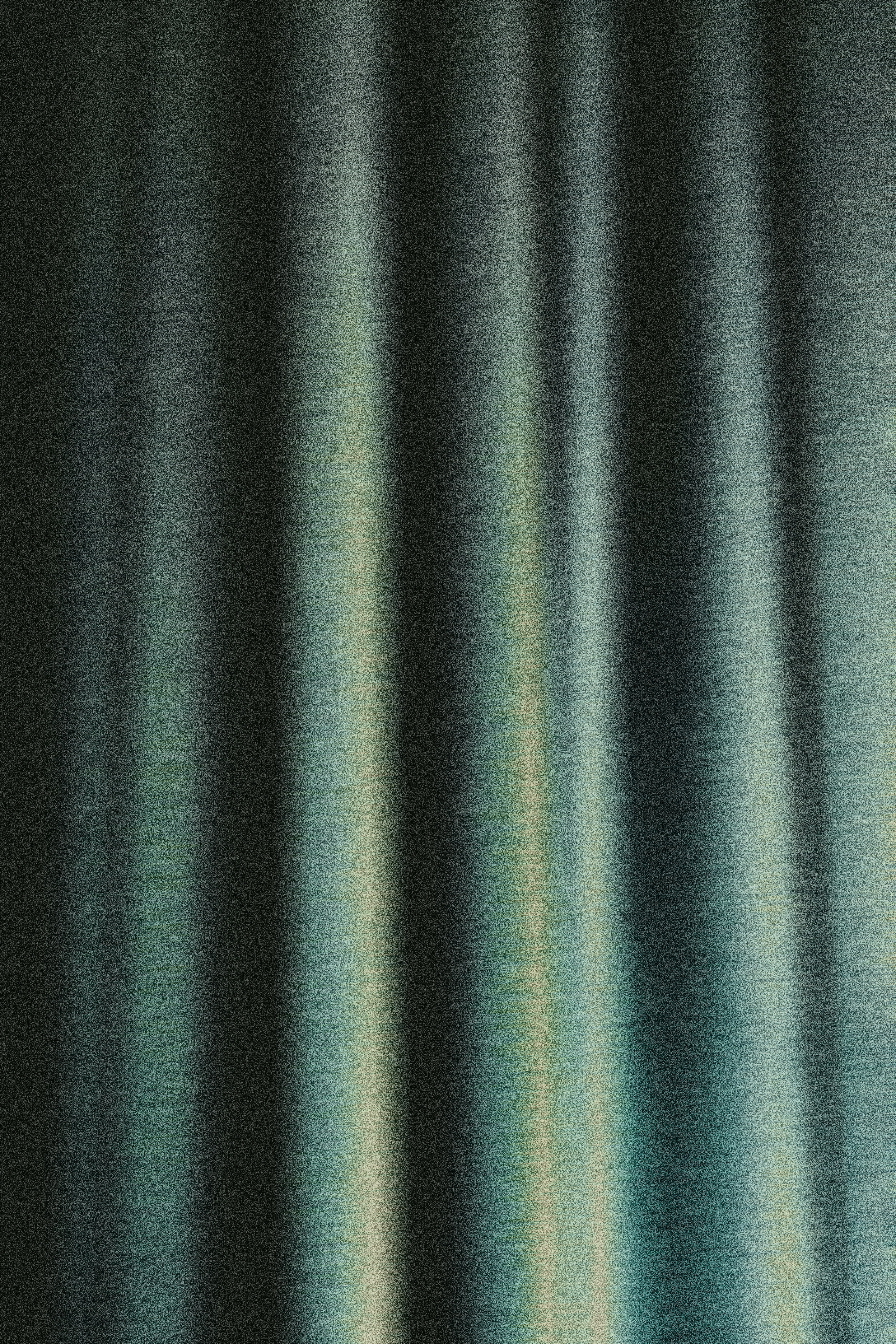 Vertical folds of dark teal fabric with a subtle metallic sheen