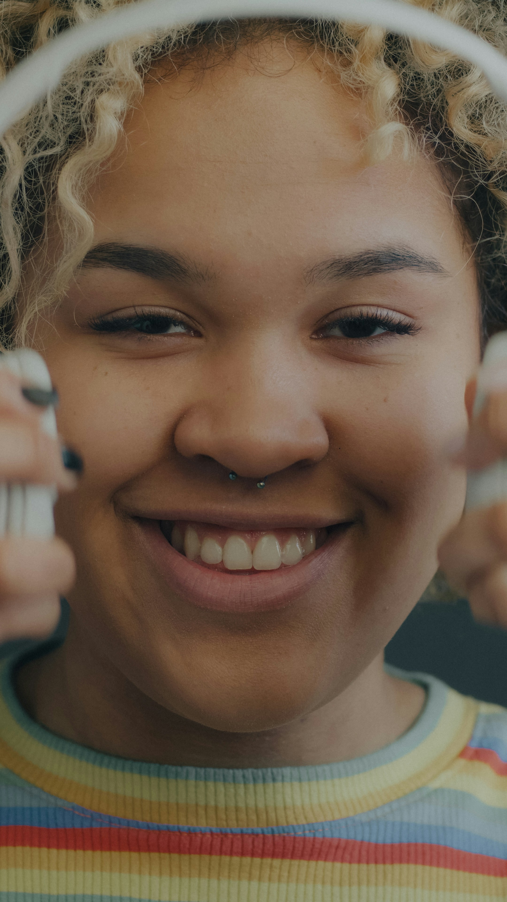Smiling listener with curly hair