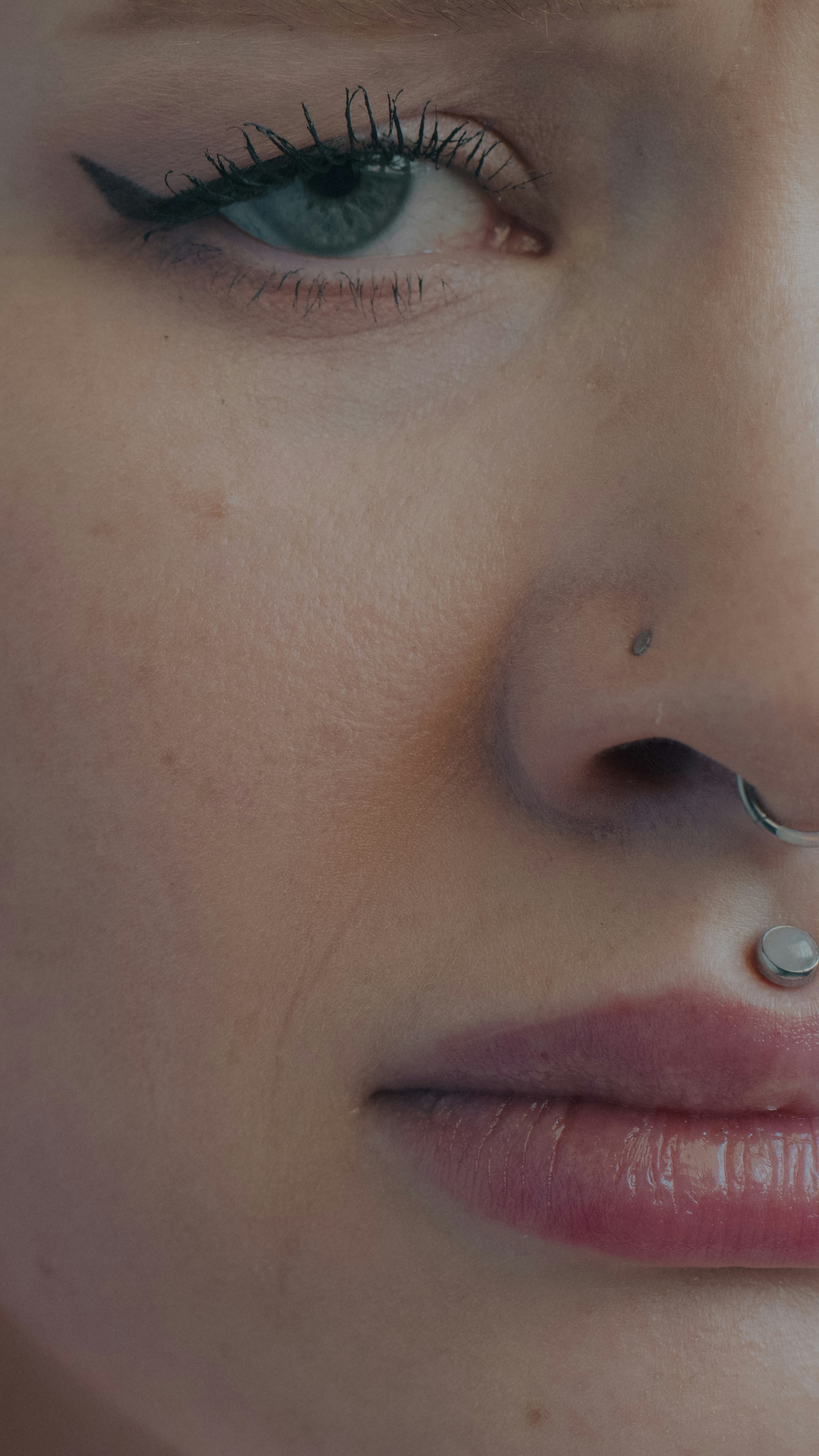 Person with eyeliner and facial piercings - Free Photo on Unsplash