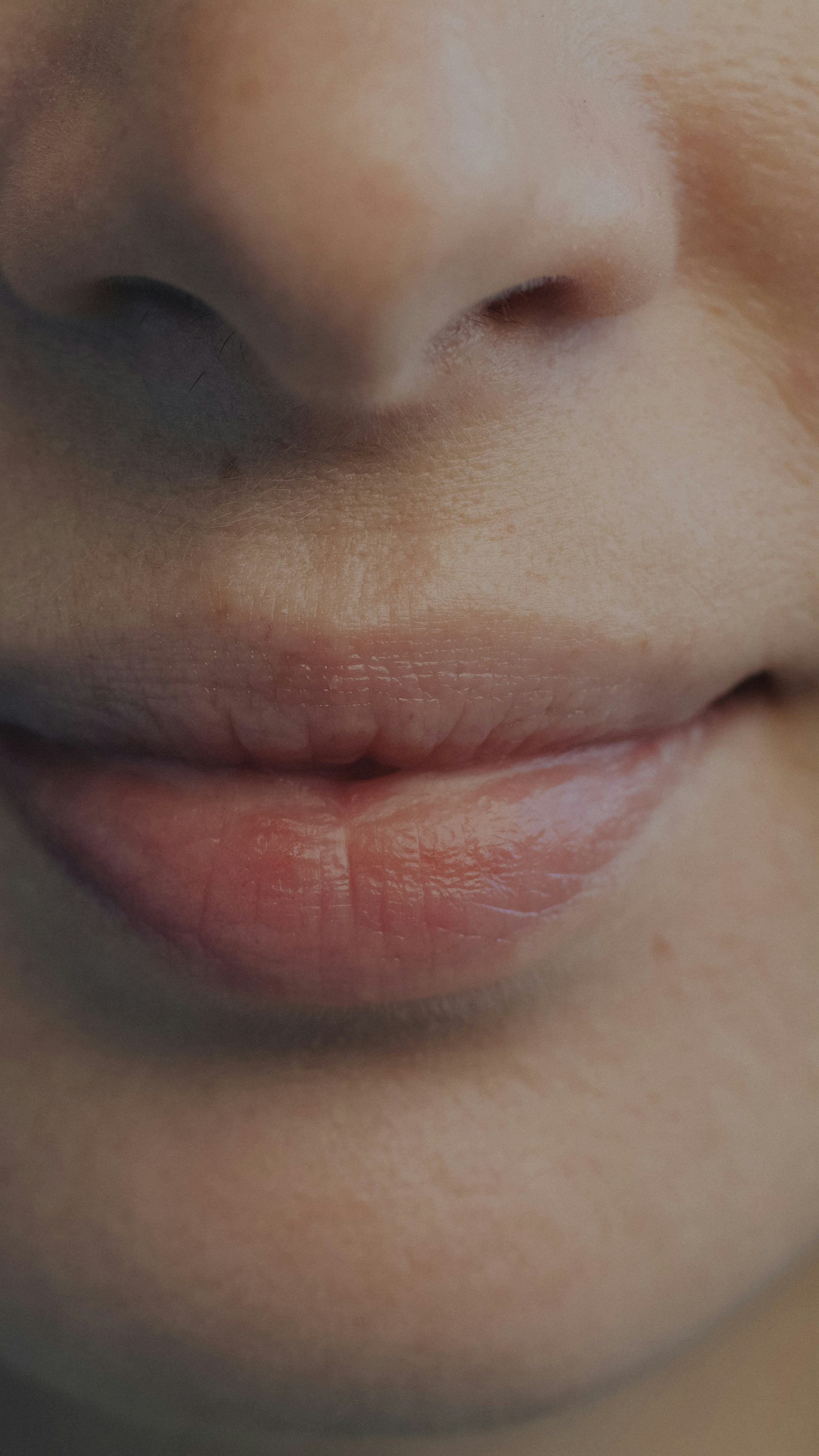 Close-up slow motion portrait of female mouth smiling expressing joy while anonymous lady feeling happy. People and positive emotion concept.