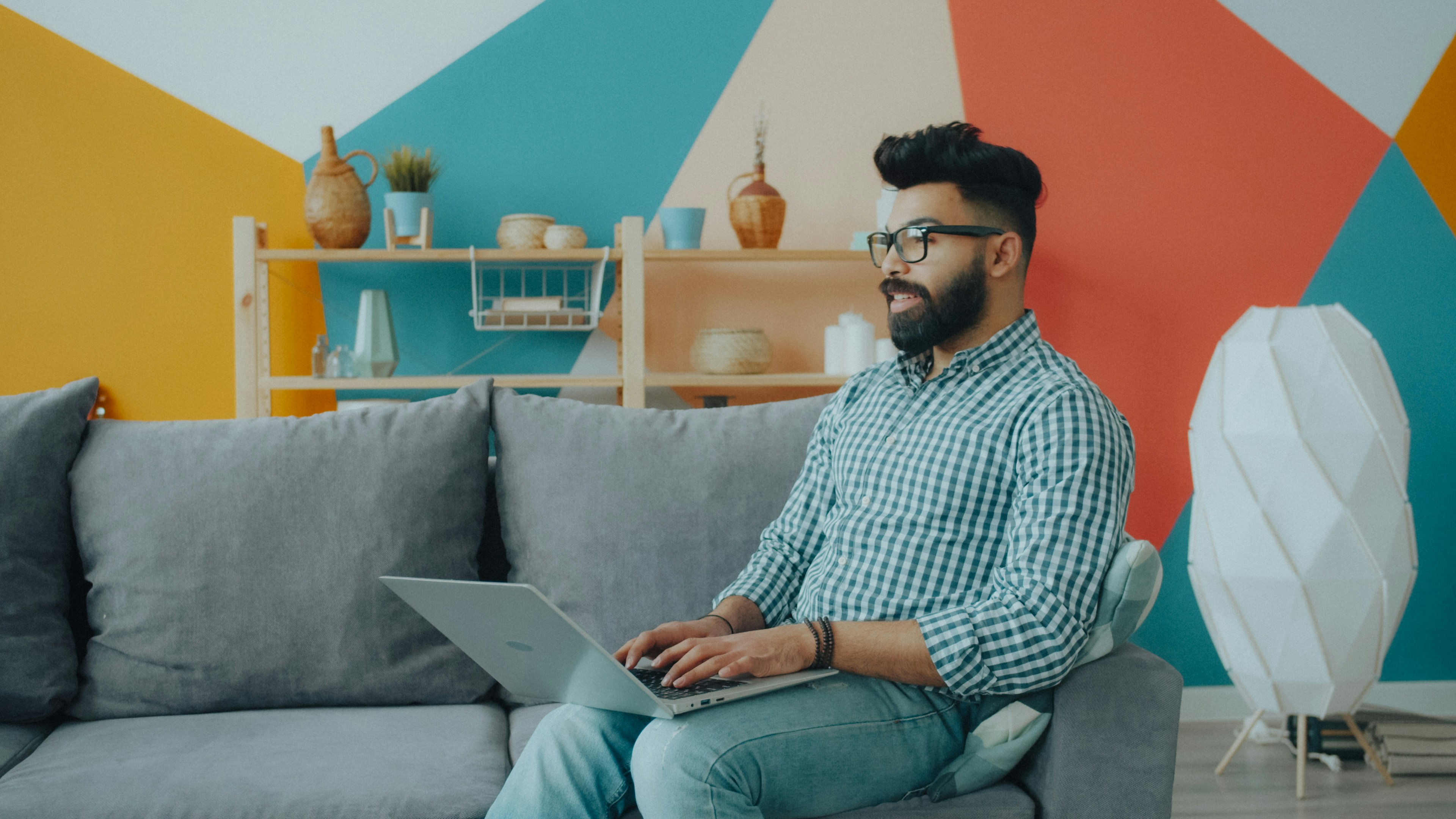 A business owner reviewing numbers on a laptop