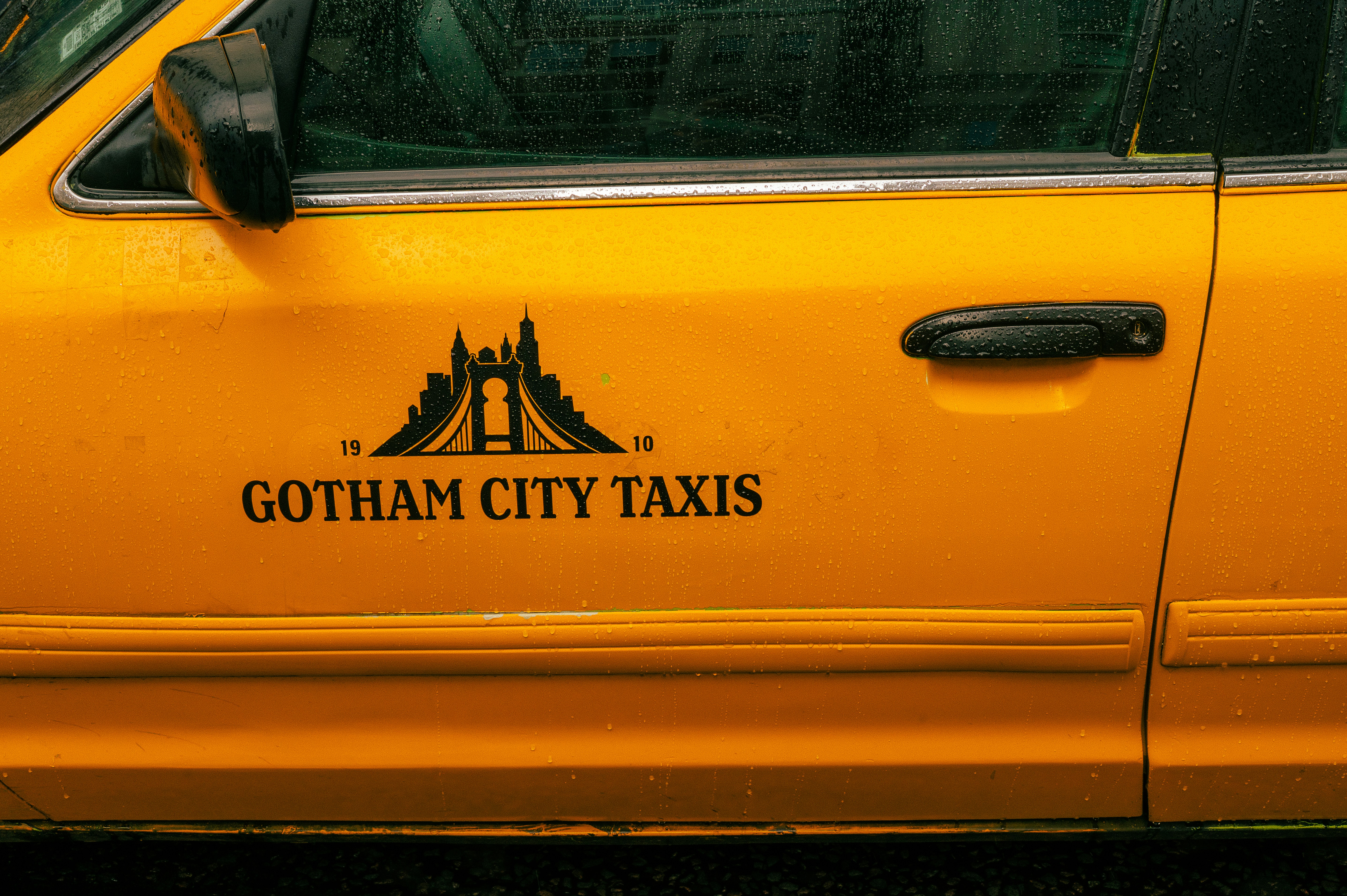 Yellow taxi door with city logo - Free Photo on Unsplash