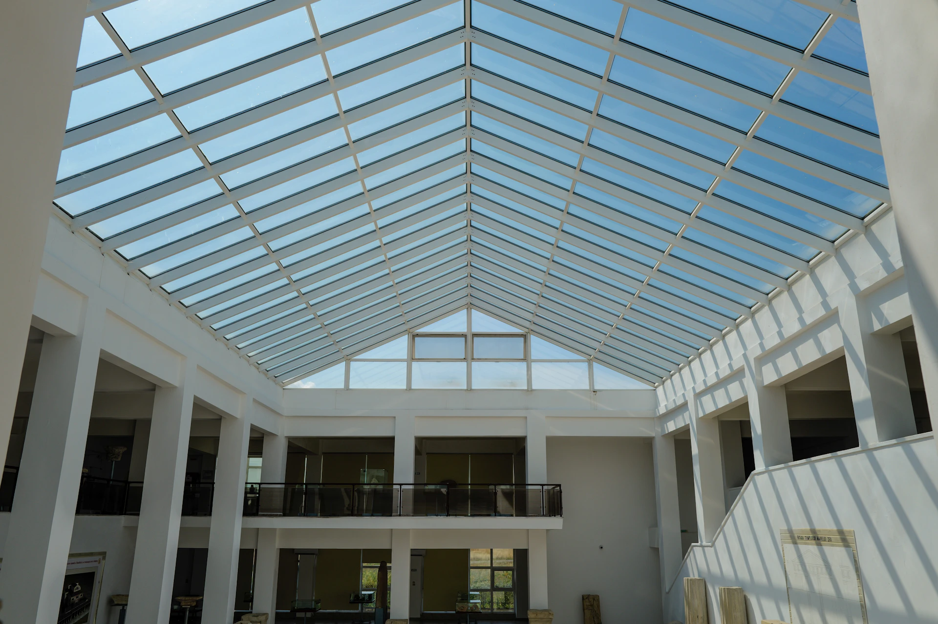 A bright atrium under a glass roof