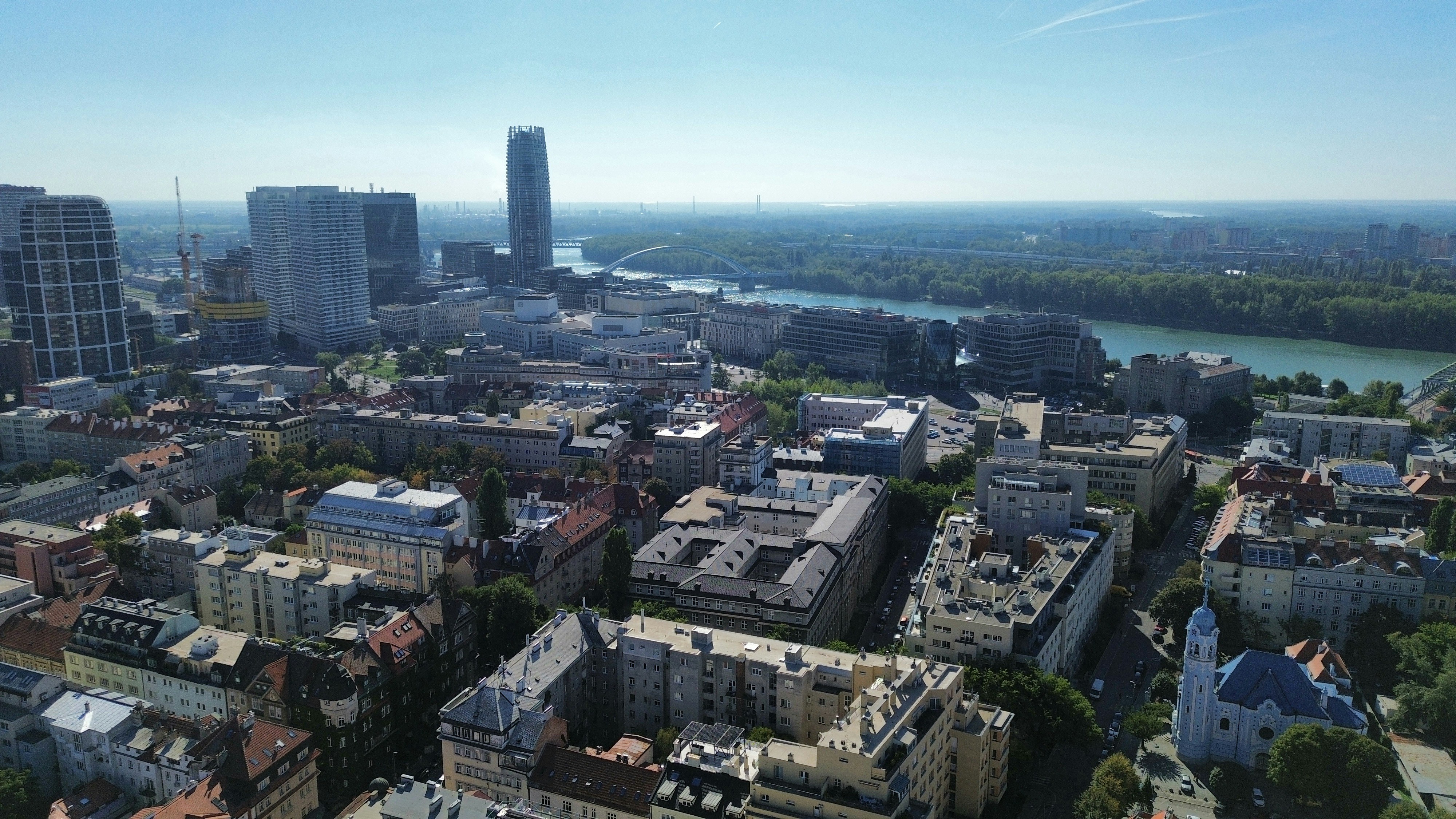 Aerial view of the city of Bratislava with the Danube river and modern skyscrapers