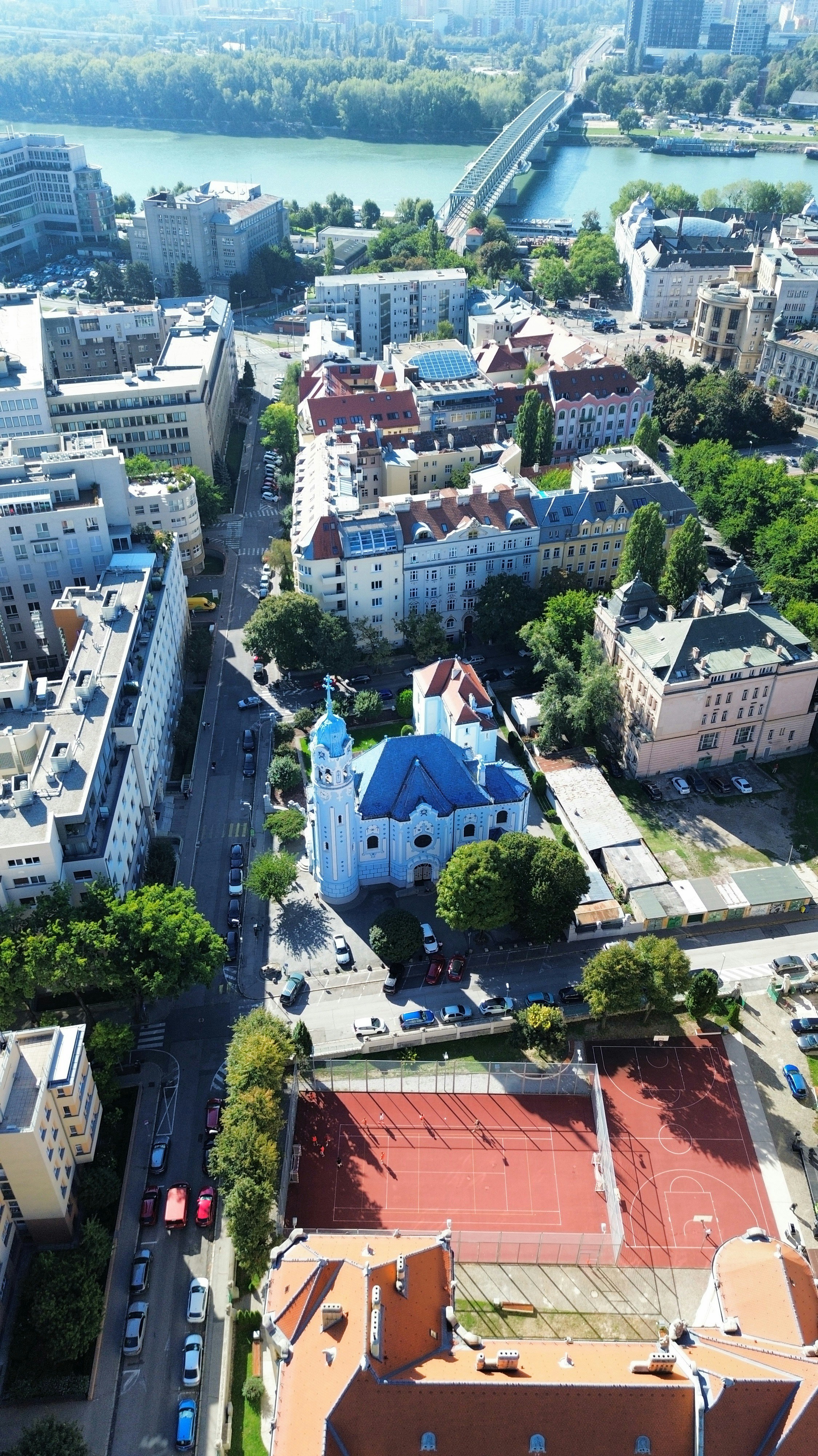 Aerial view of the Blue Church in Bratislava with surrounding city streets and buildings