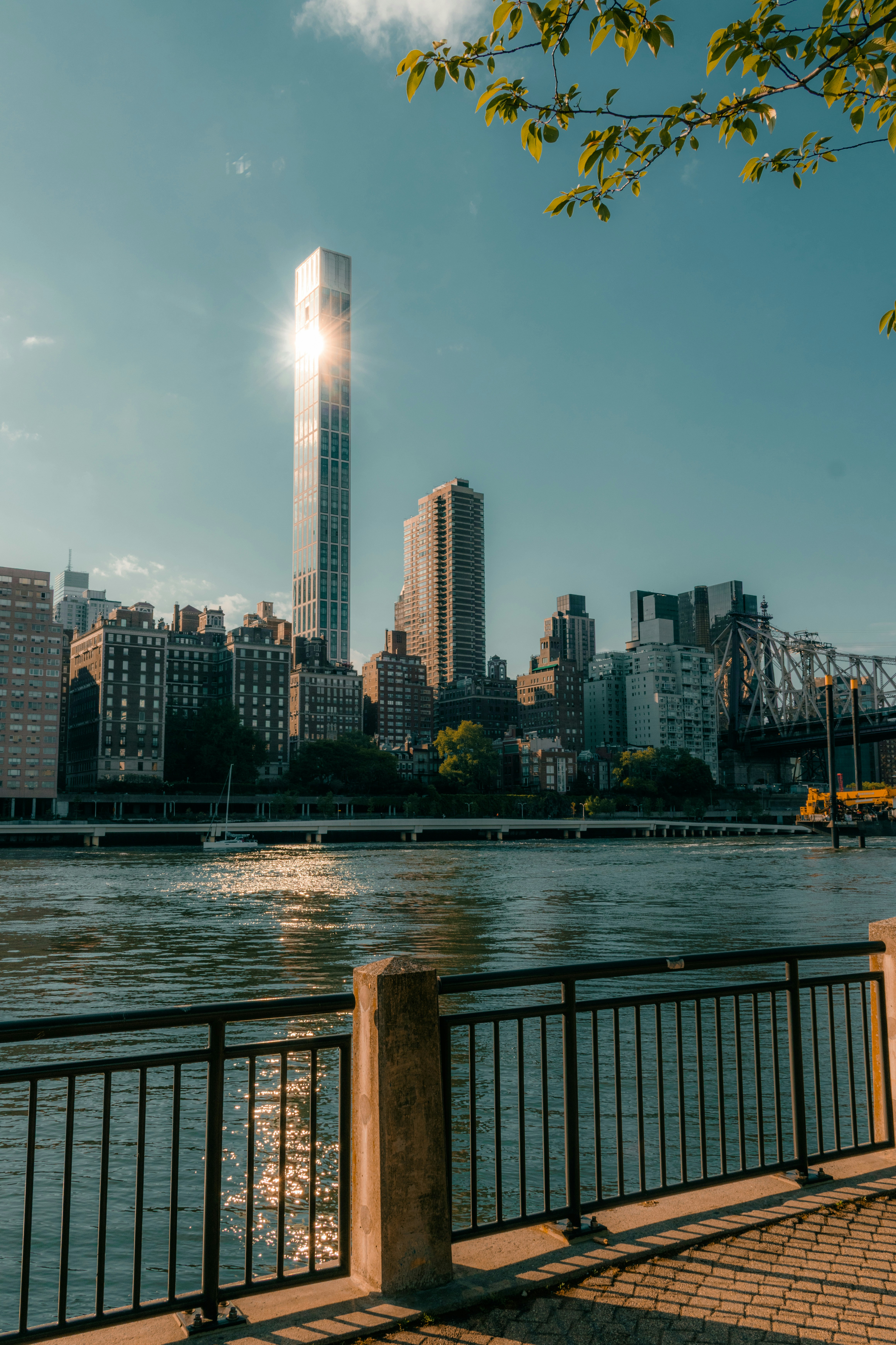 Sunlight reflecting off a tall skyscraper across the East River in New York City