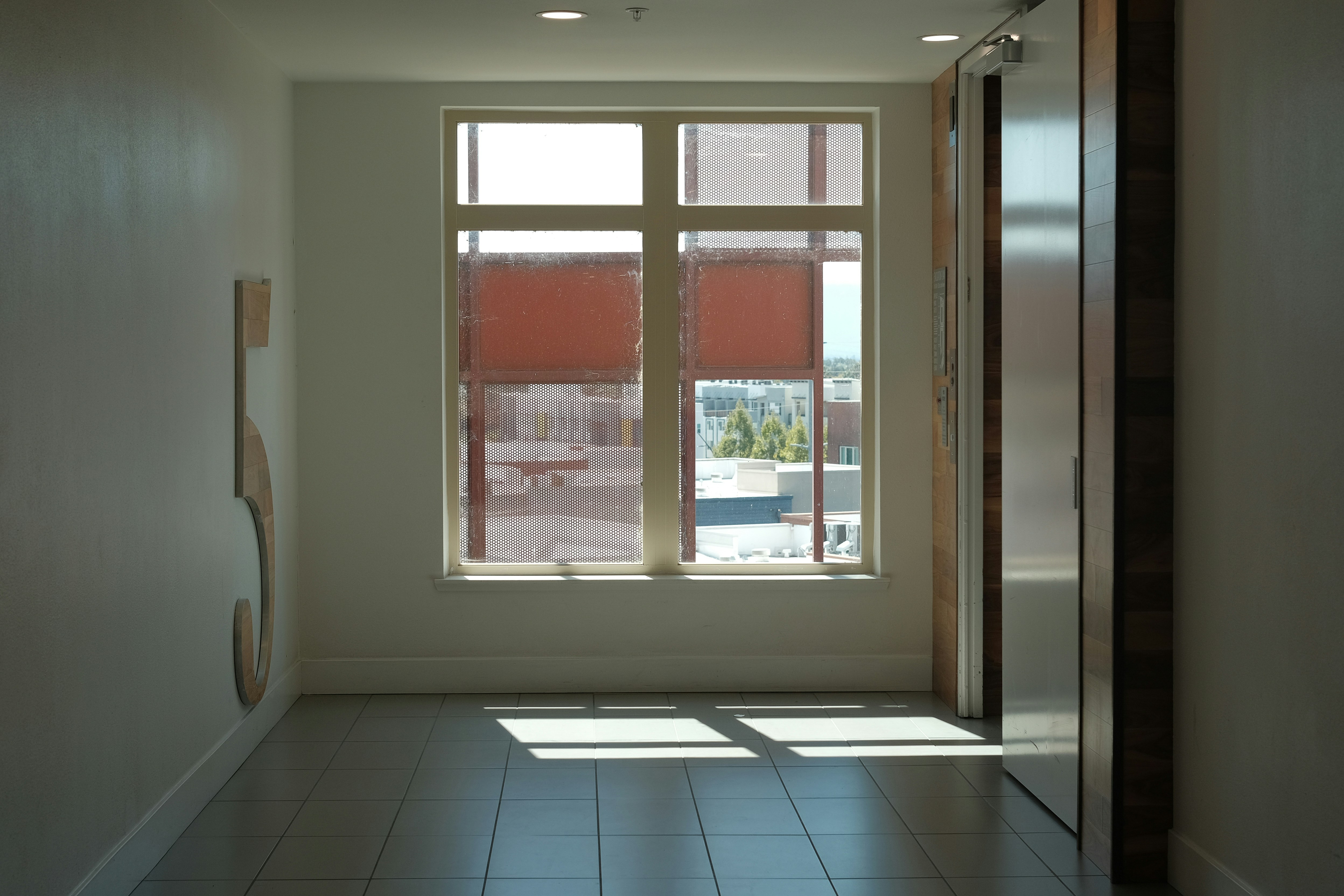 Sunlit hallway with a large window