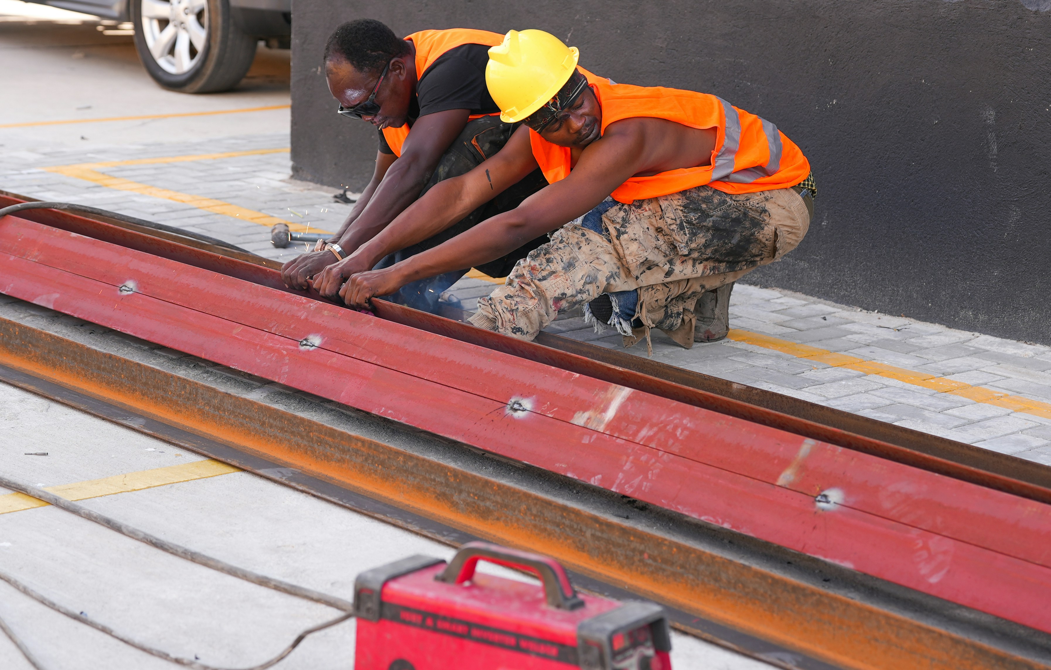 Rolling out custom seamless gutters from a contractor truck