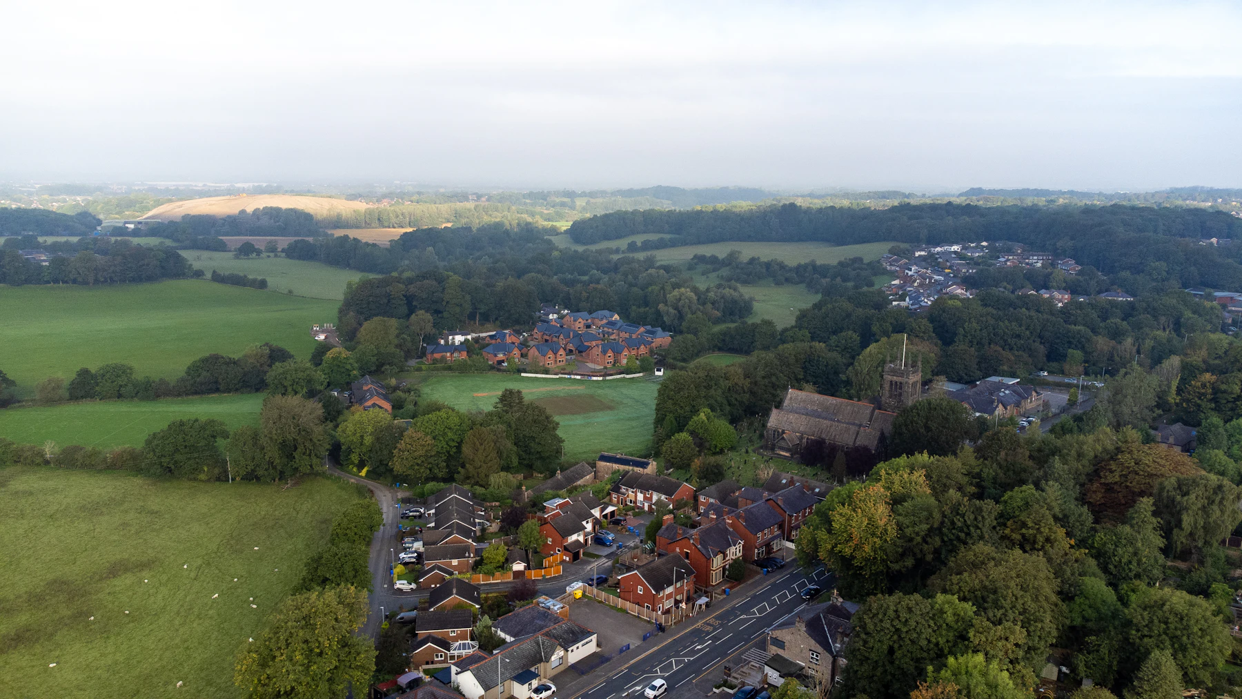 An English village and fields from the air