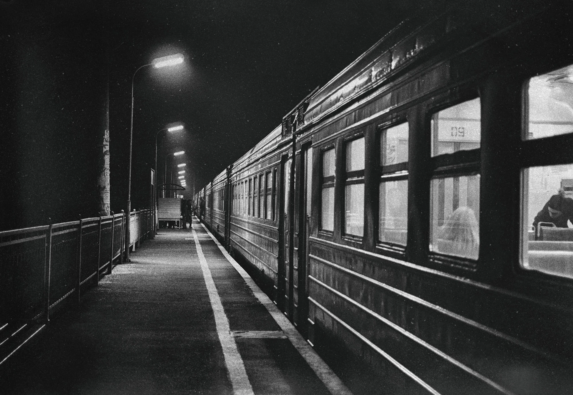 A train at a dim platform at night