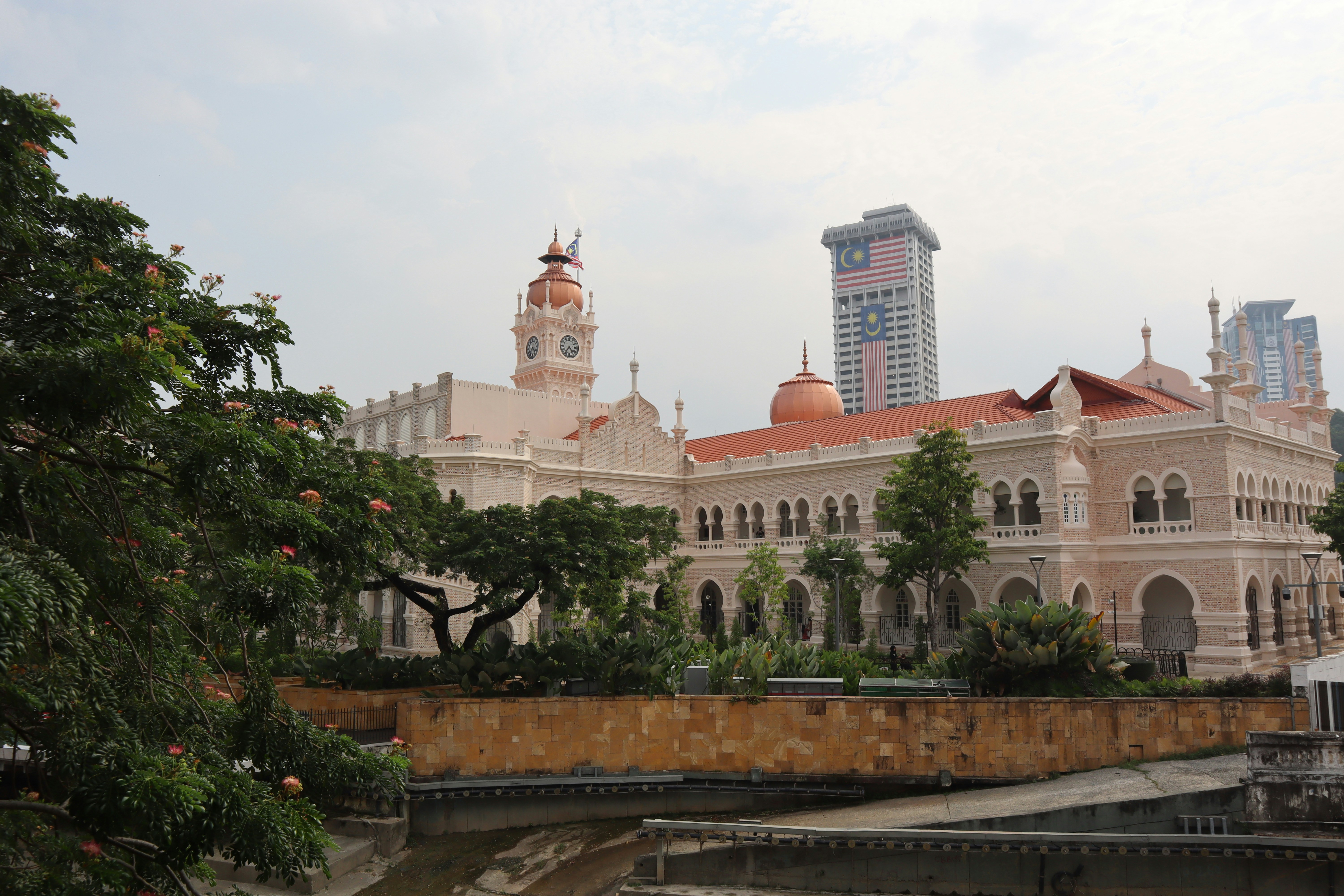 The Sultan Abdul Samad Building with its clock tower and copper domes in Kuala Lumpur