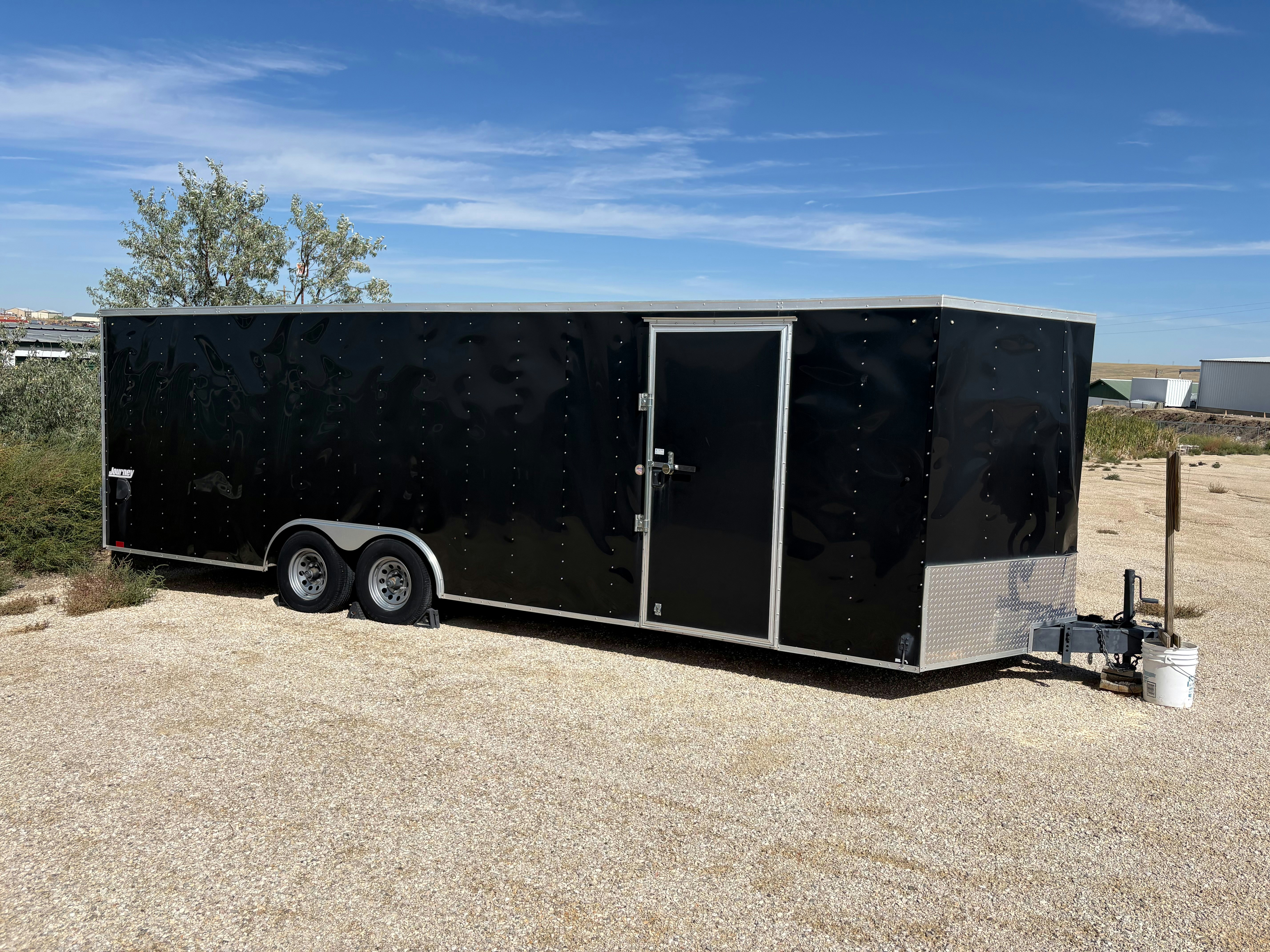 Enclosed cargo trailer parked on a gravel lot — trailer, truck & equipment welding in Brooklyn