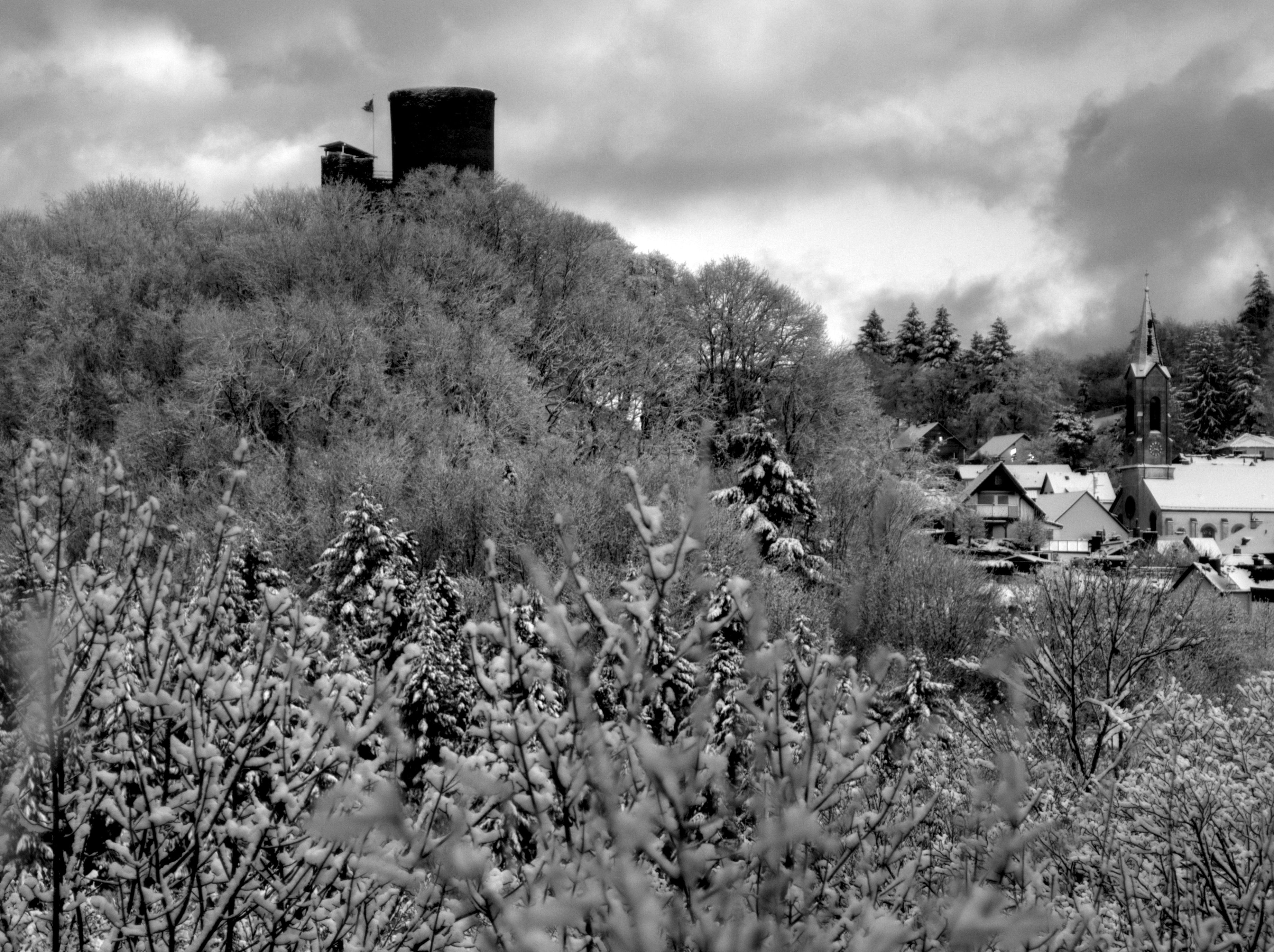 Stone castle tower in snowy village - Free Photo on Unsplash