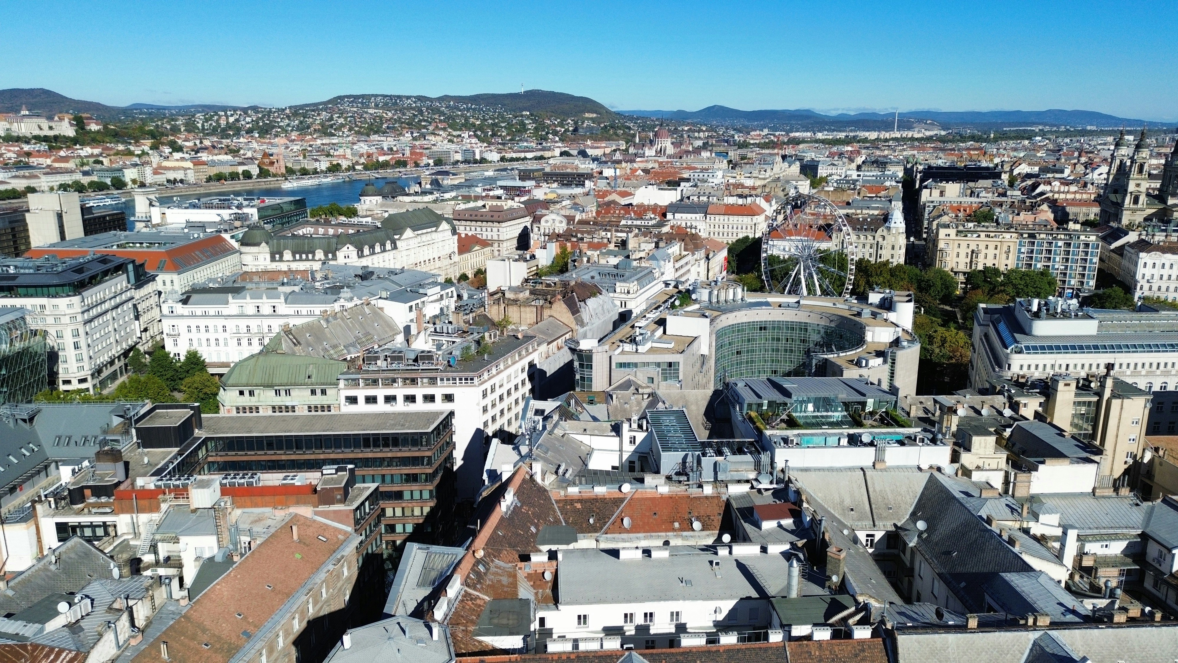 Aerial view of the city of Budapest with a ferris wheel and river