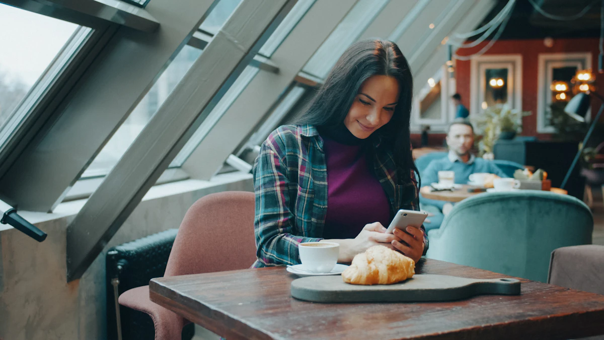 Woman smiling at a text message in a cafe