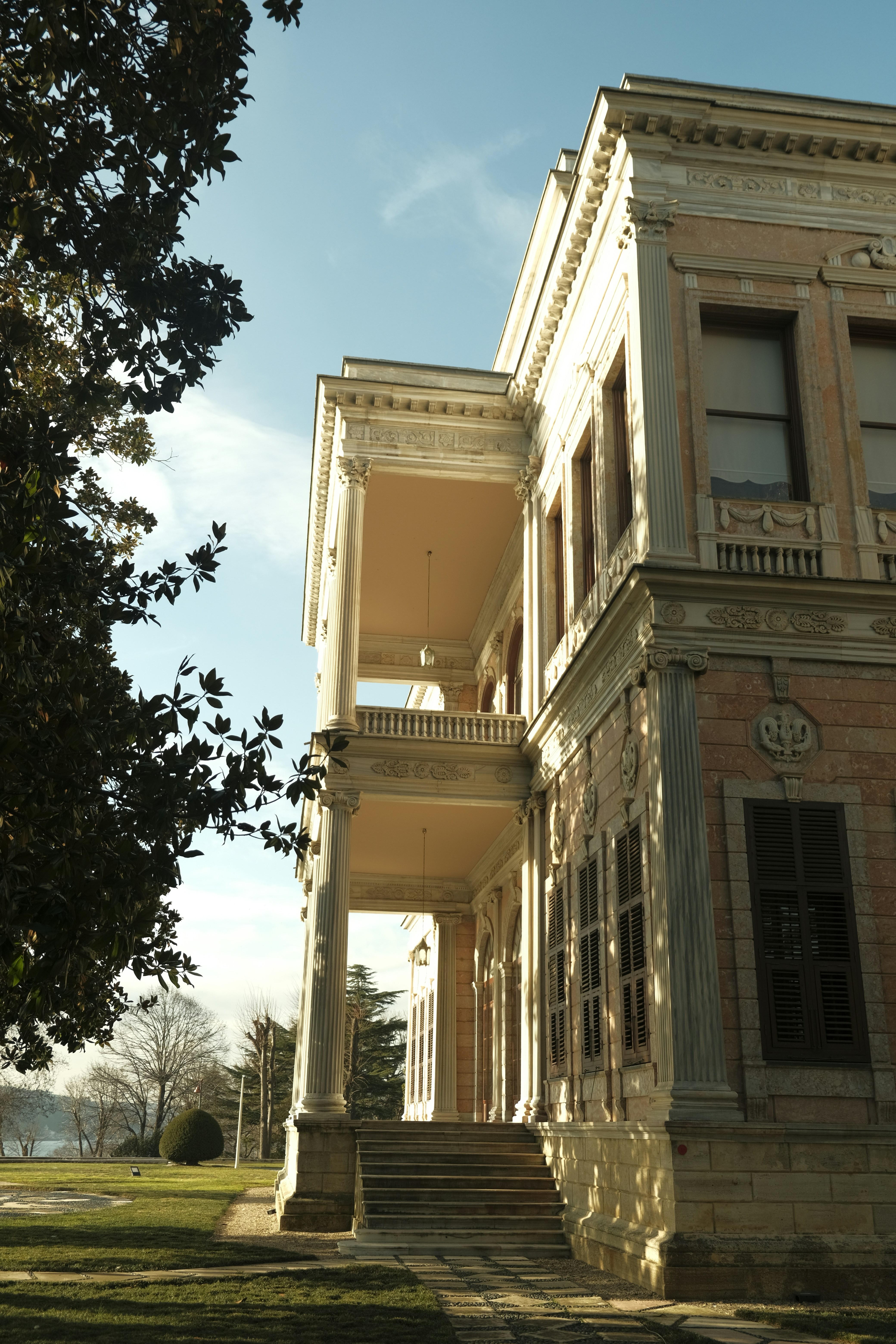 A neoclassical mansion with stone columns and a balcony in Istanbul