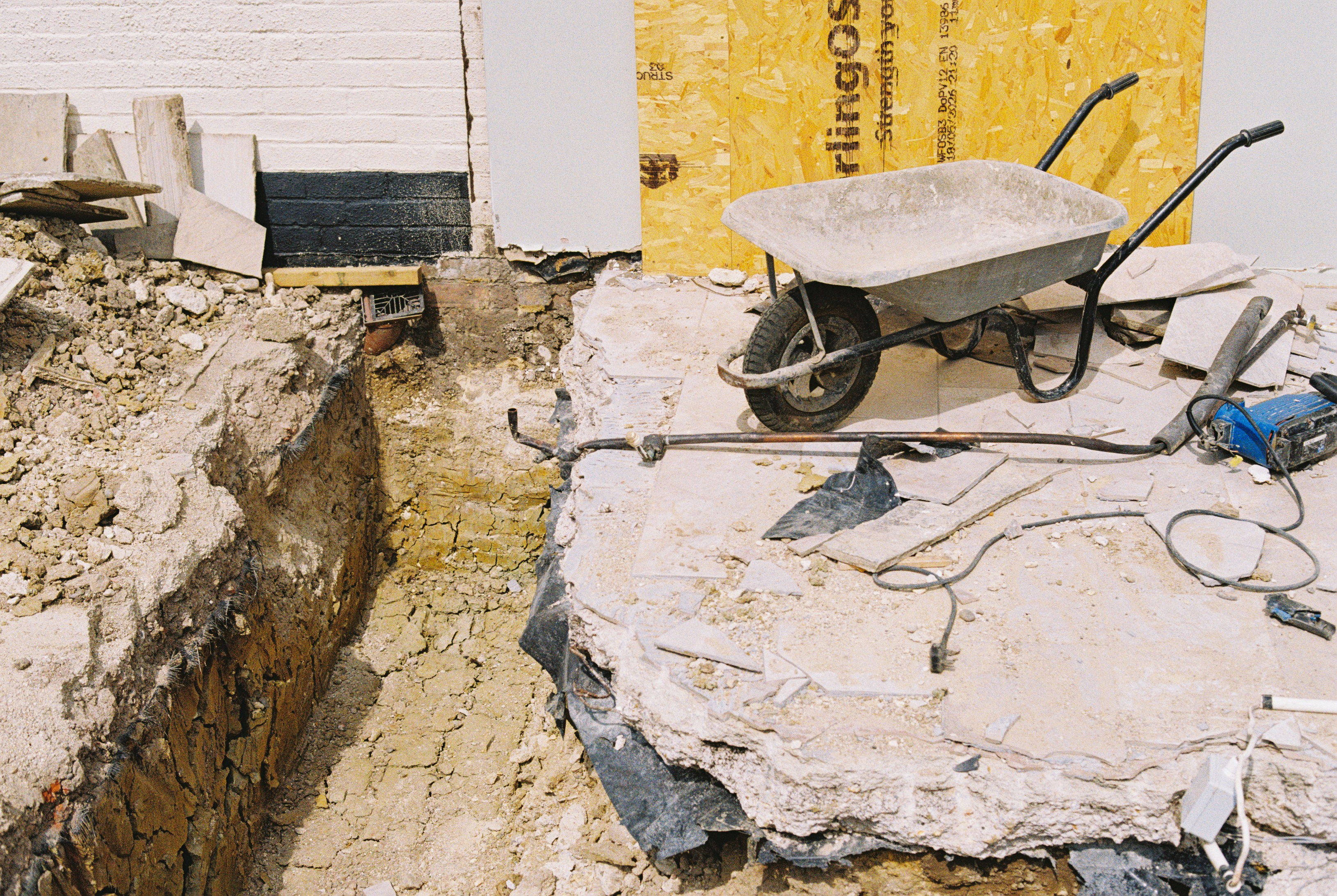 Plumbing rough-in and slab trenching in a garage conversion
