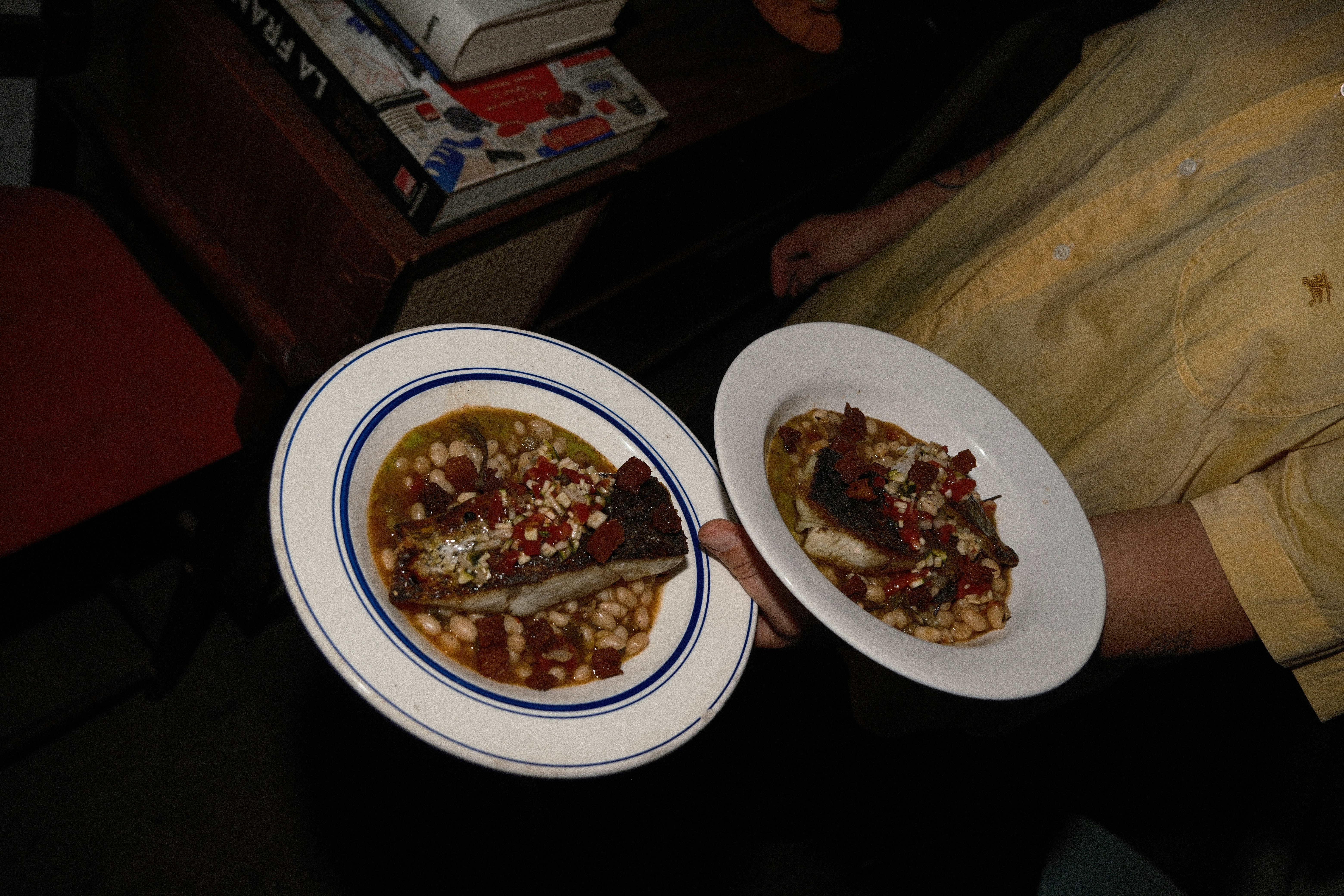 Server holding two plates