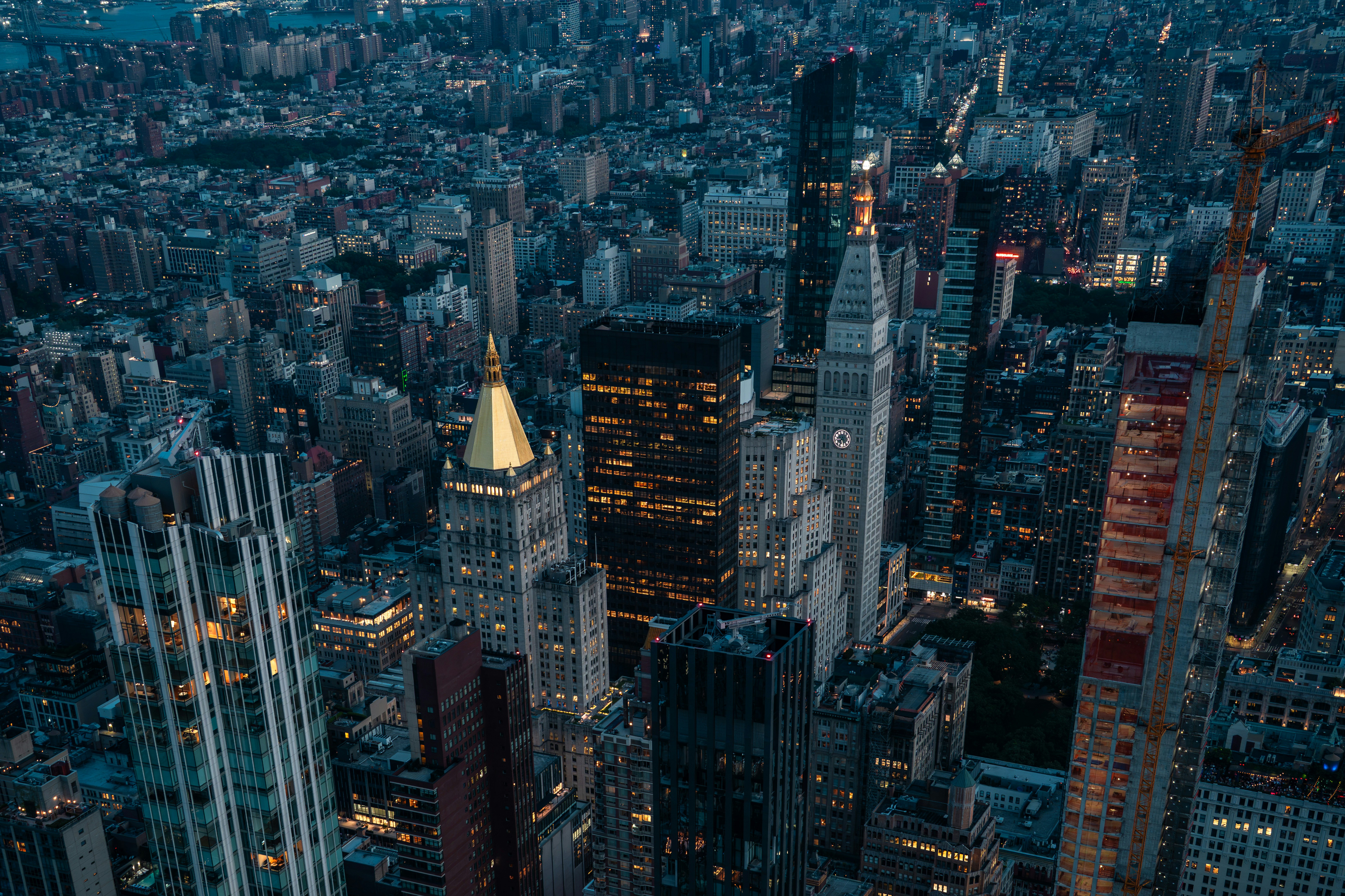 Aerial view of the New York City skyline at night with illuminated skyscrapers