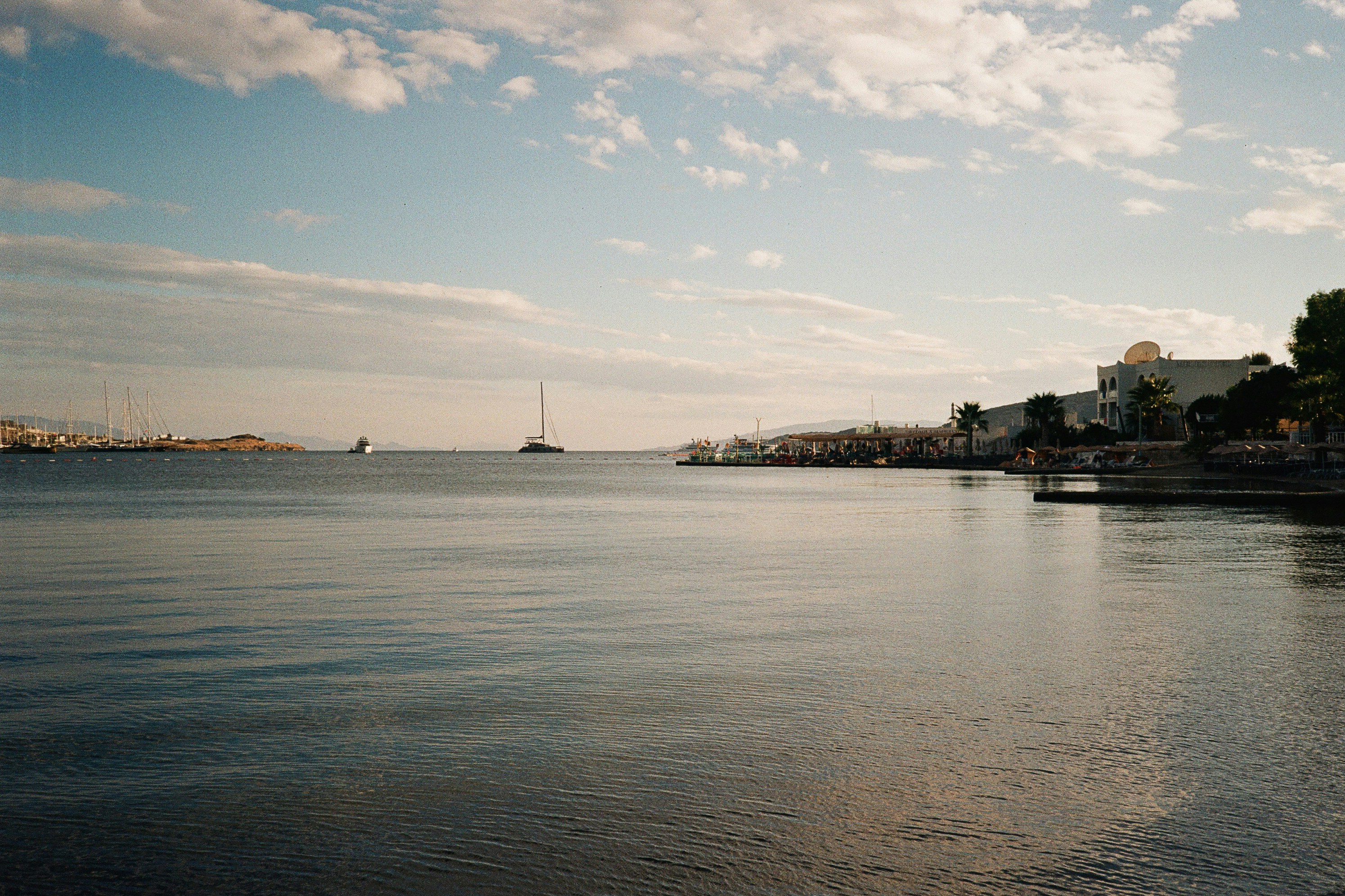 Boats on the calm water of the Aegean Sea in Bodrum, Türkiye