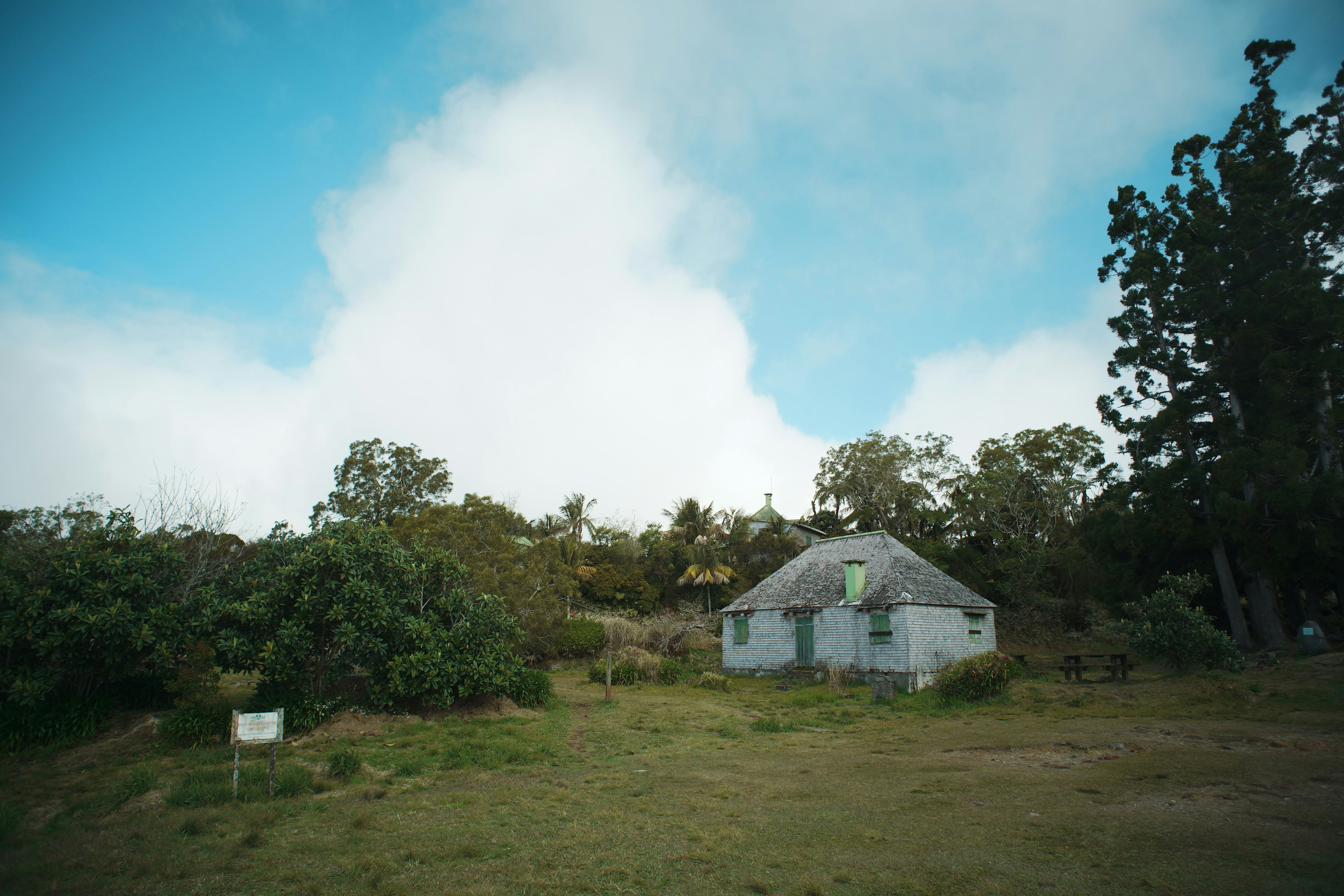Grey cottage in grassy clearing - Free Photo on Unsplash