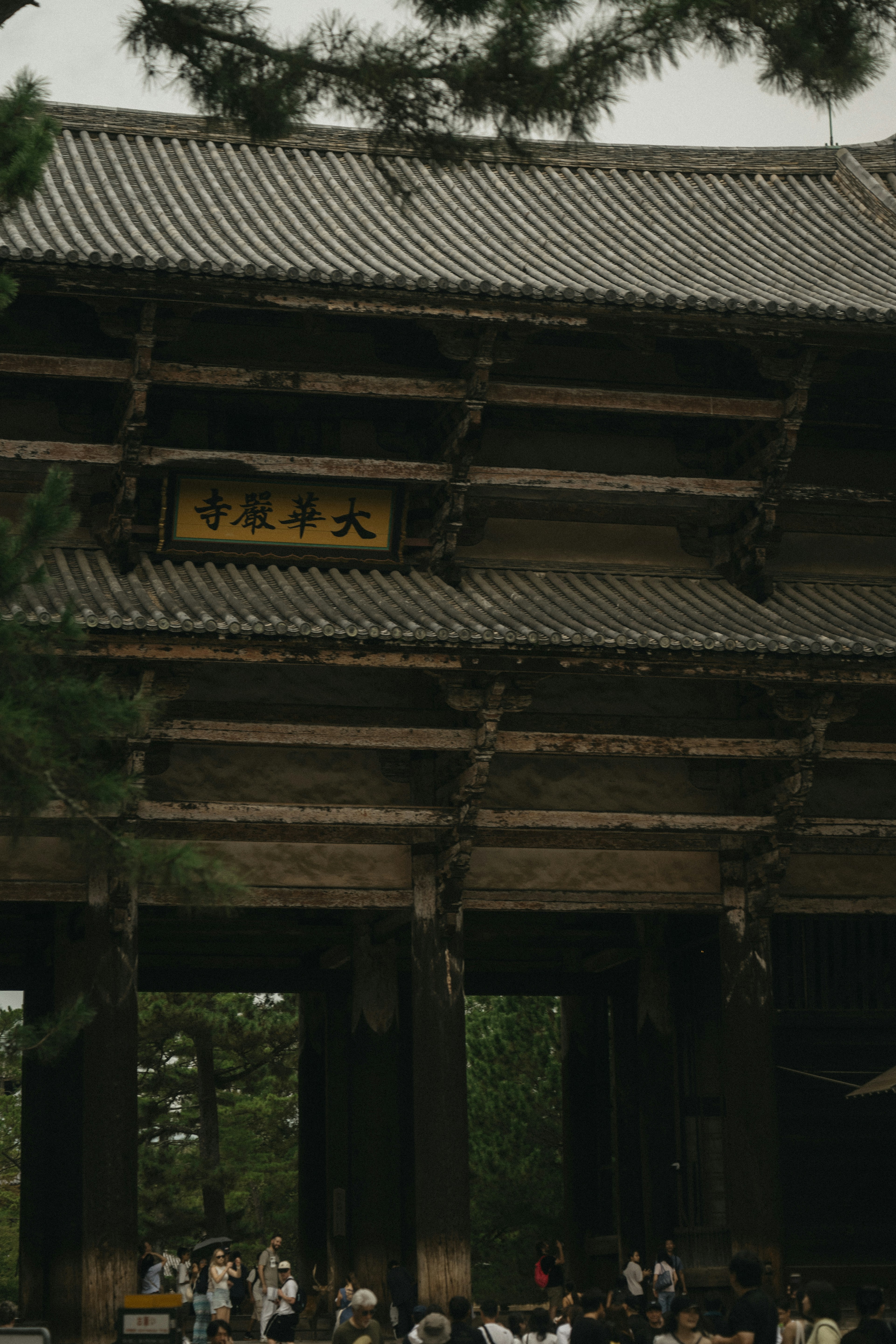 The wooden Nandaimon gate at Todai-ji temple in Nara with a crowd of visitors
